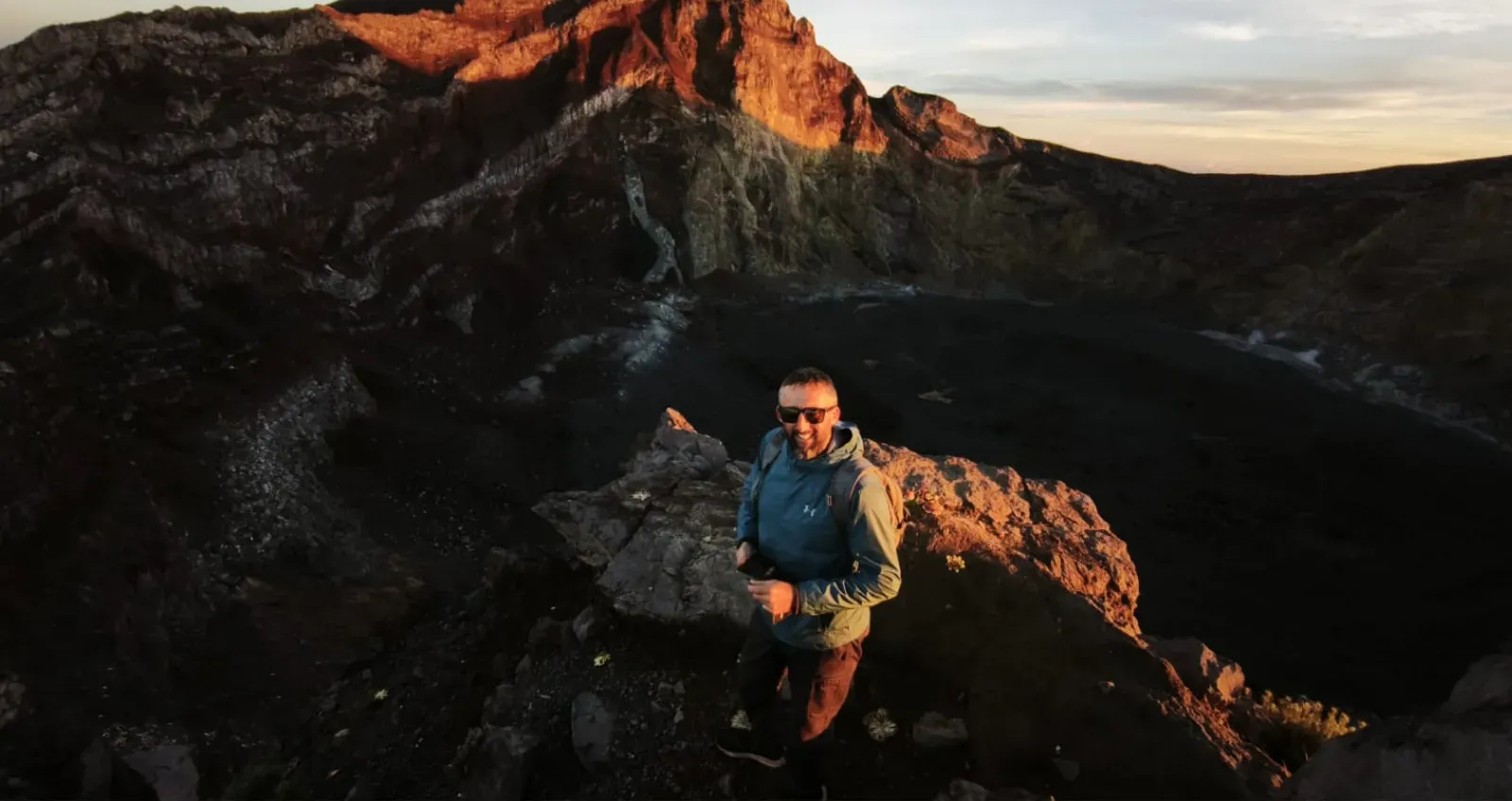 Panoramic sunrise above volcanic ridges of Mount Agung