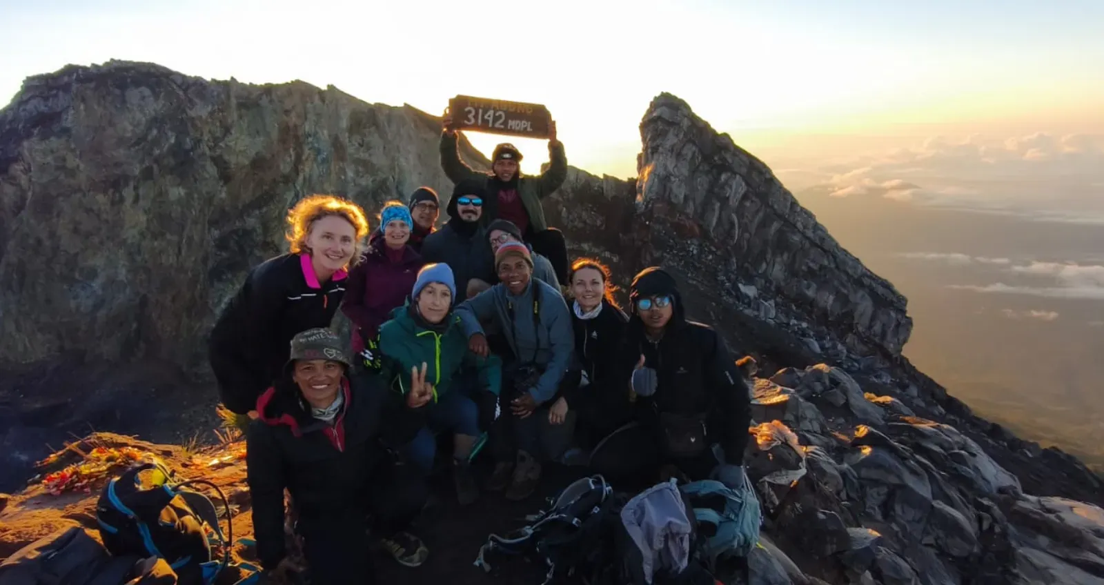 Trekking group at the Mount Agung 3142 MDPL summit at sunrise