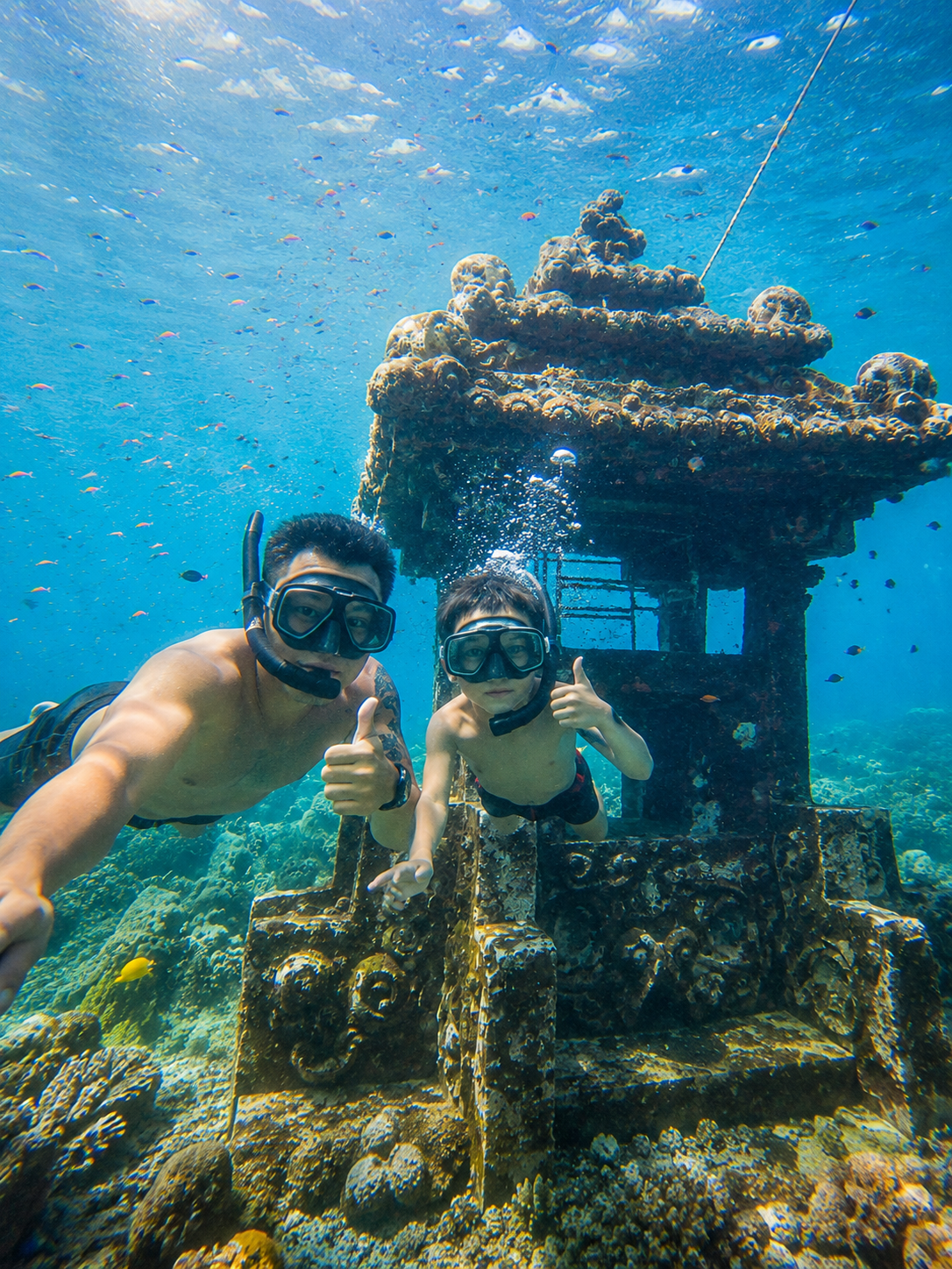 Submerged temple statues underwater