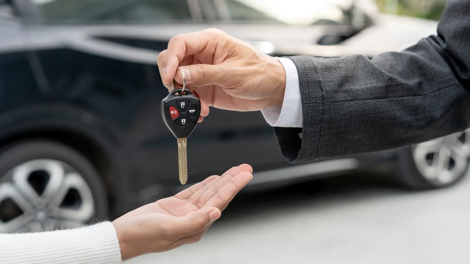 Car key being handed over