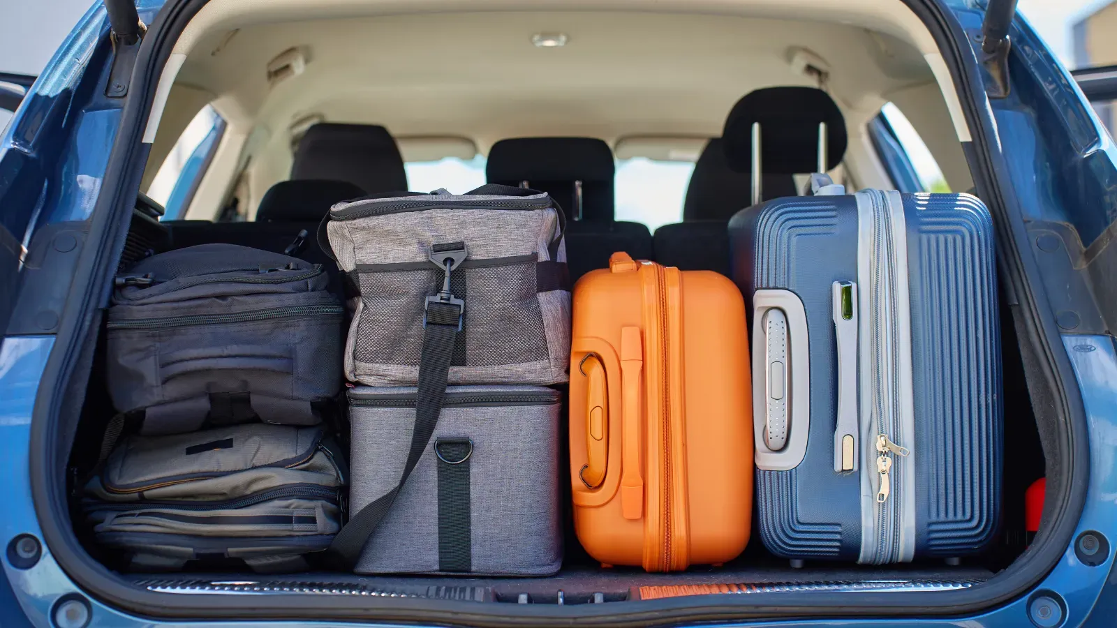 Luggage packed in a car trunk