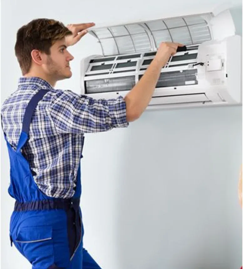 Technician servicing cooling equipment