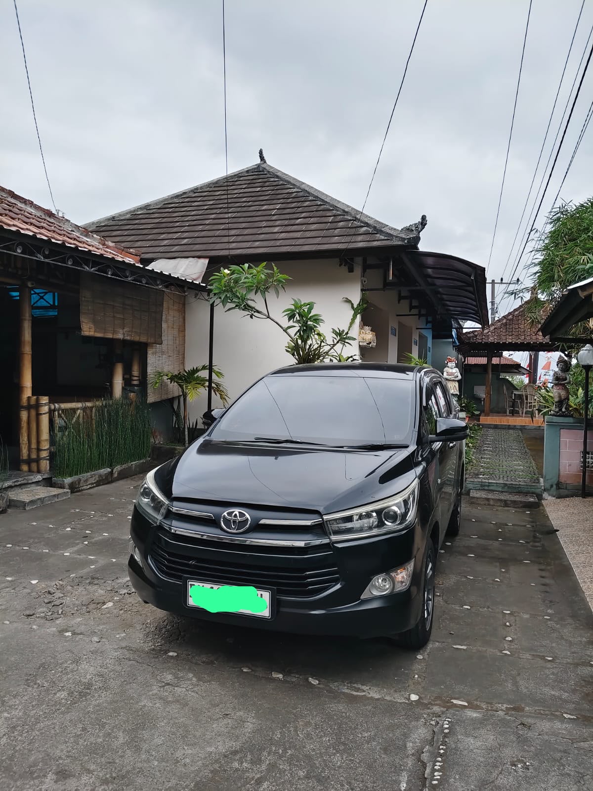 Private car driving through a scenic Bali road