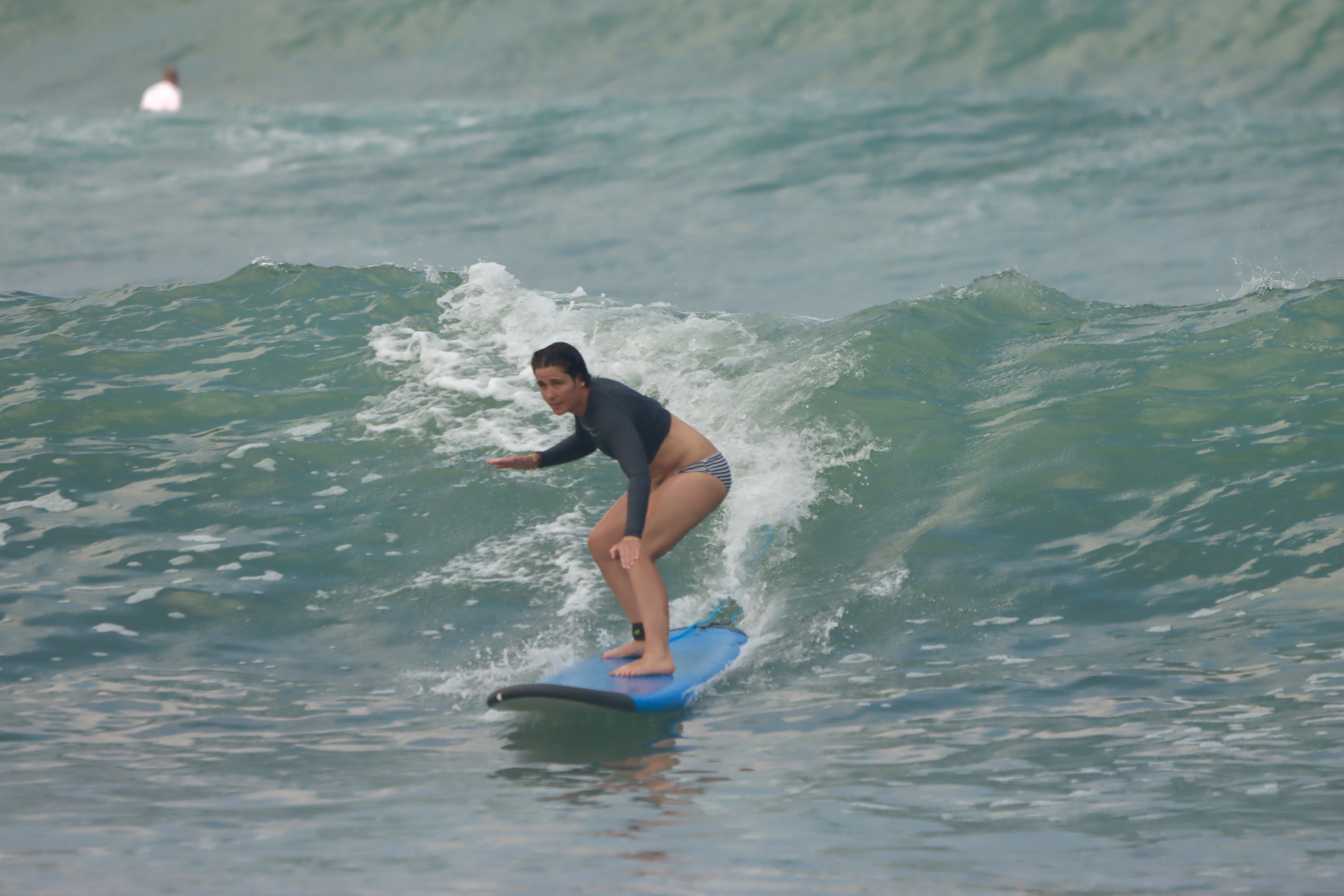 Surf lesson on rolling wave