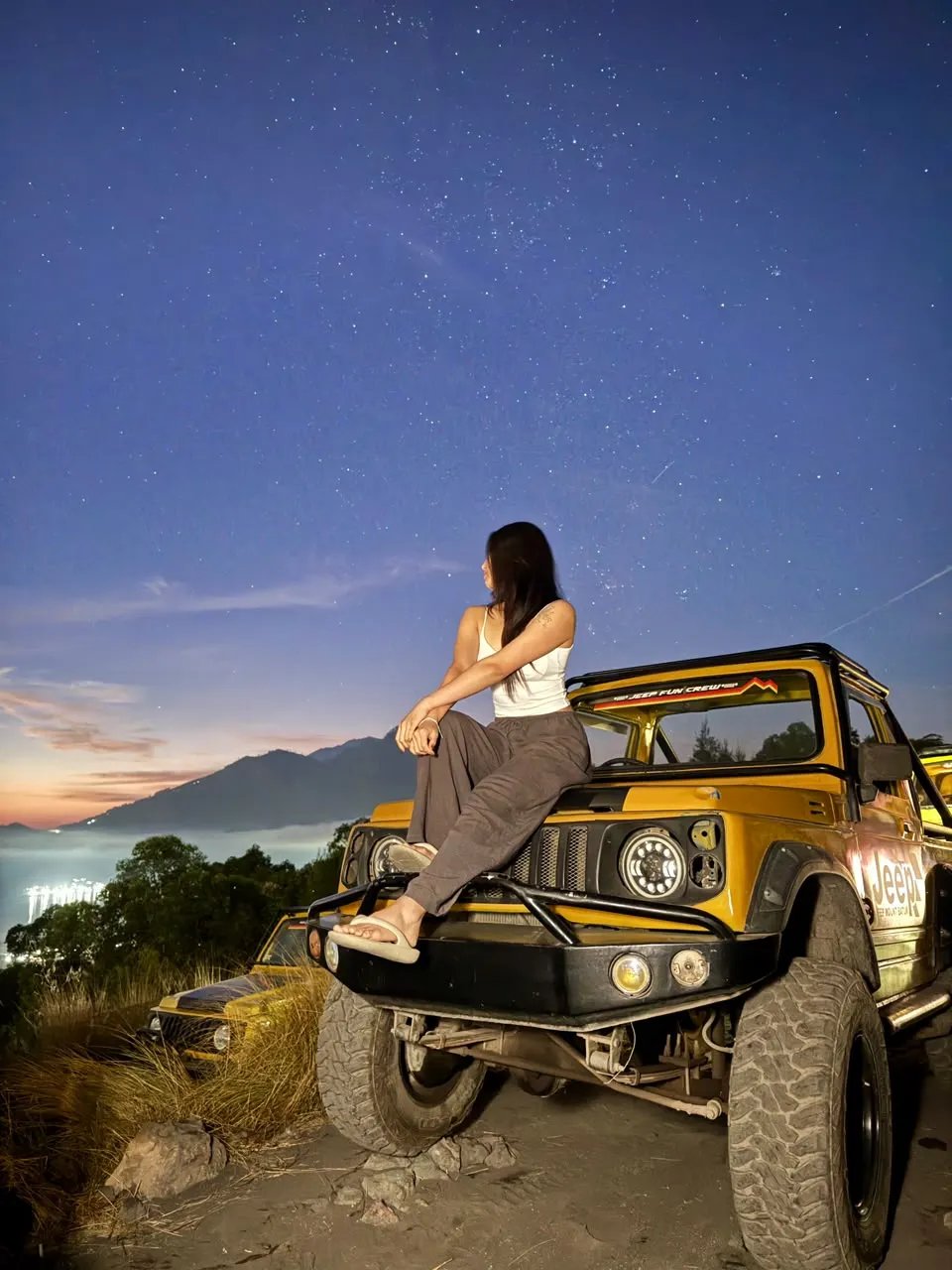 Yellow jeep at the pre-dawn viewpoint, the ride included with hotel pickup
