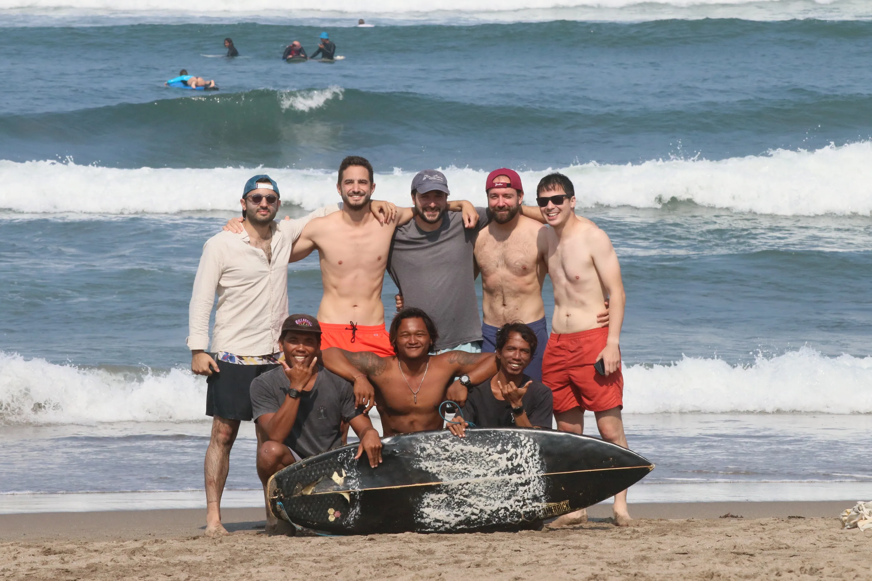 Surf lesson in the water near a Bali beach