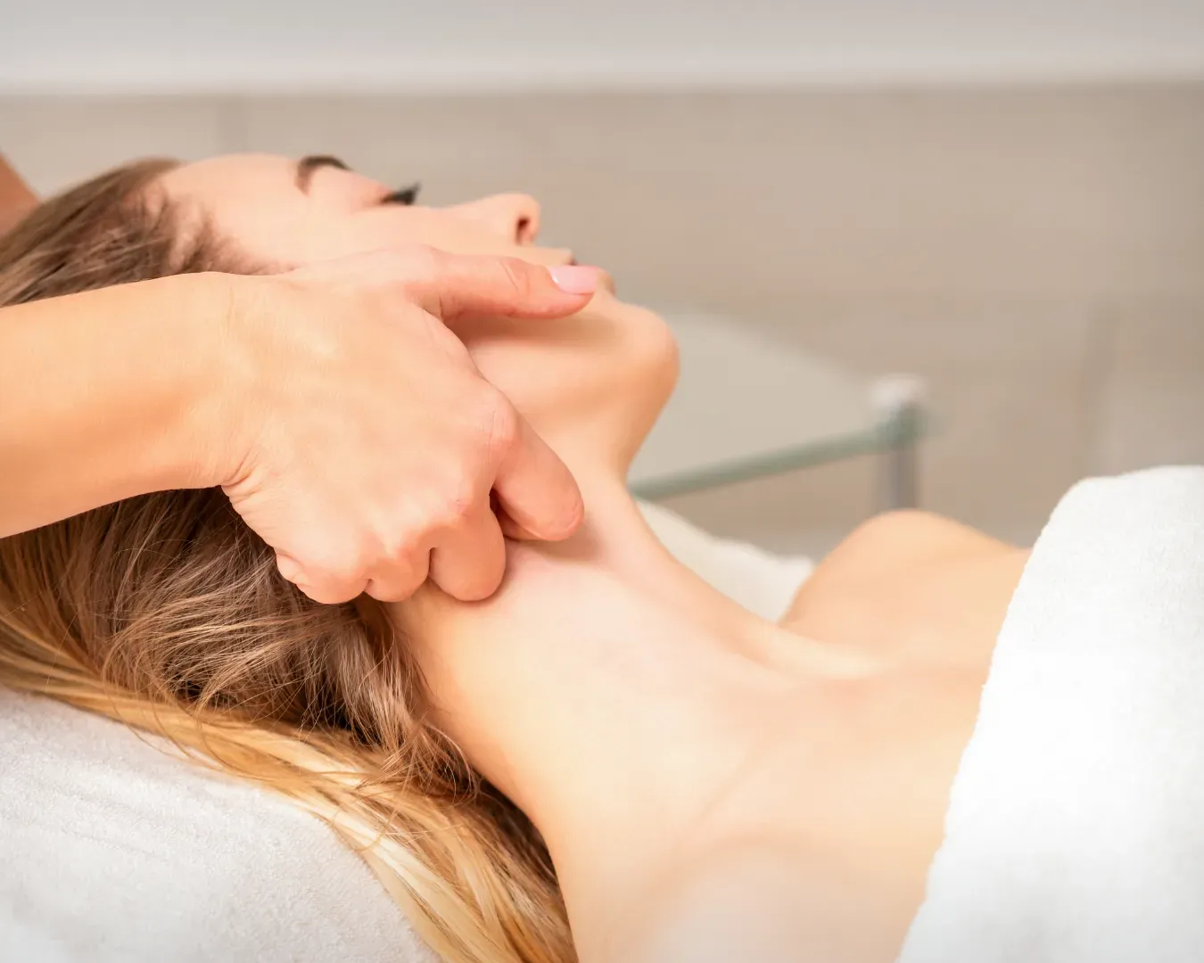 Hands-on massage during a lymphatic drainage session