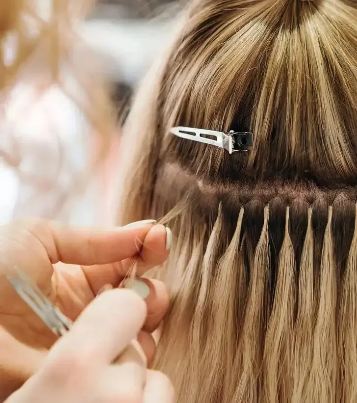 Hair brushes laid out on a styling station