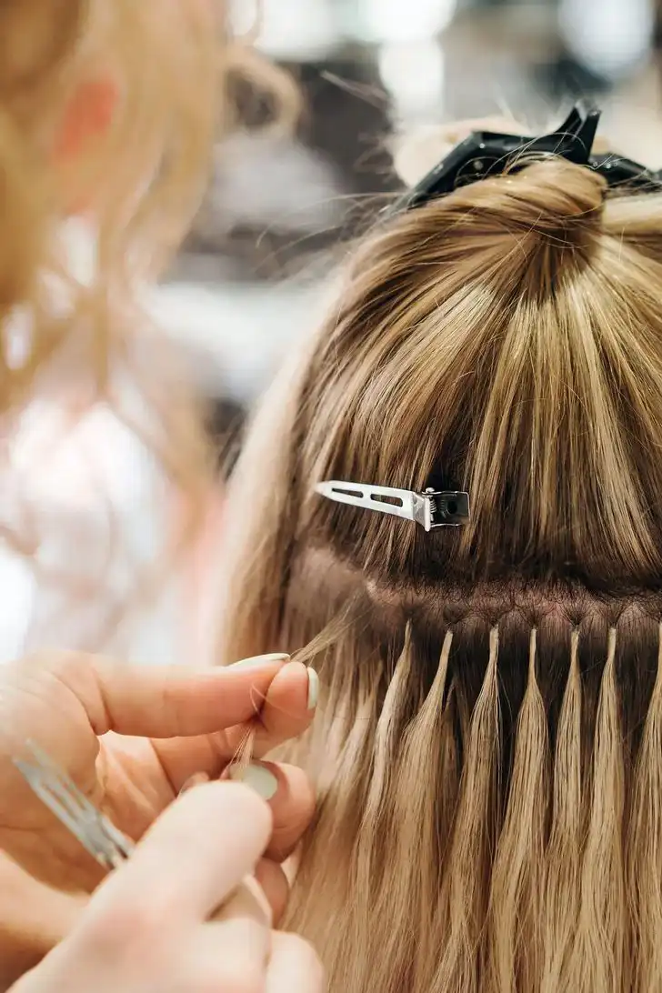 Hair styling station with brushes and warm lighting