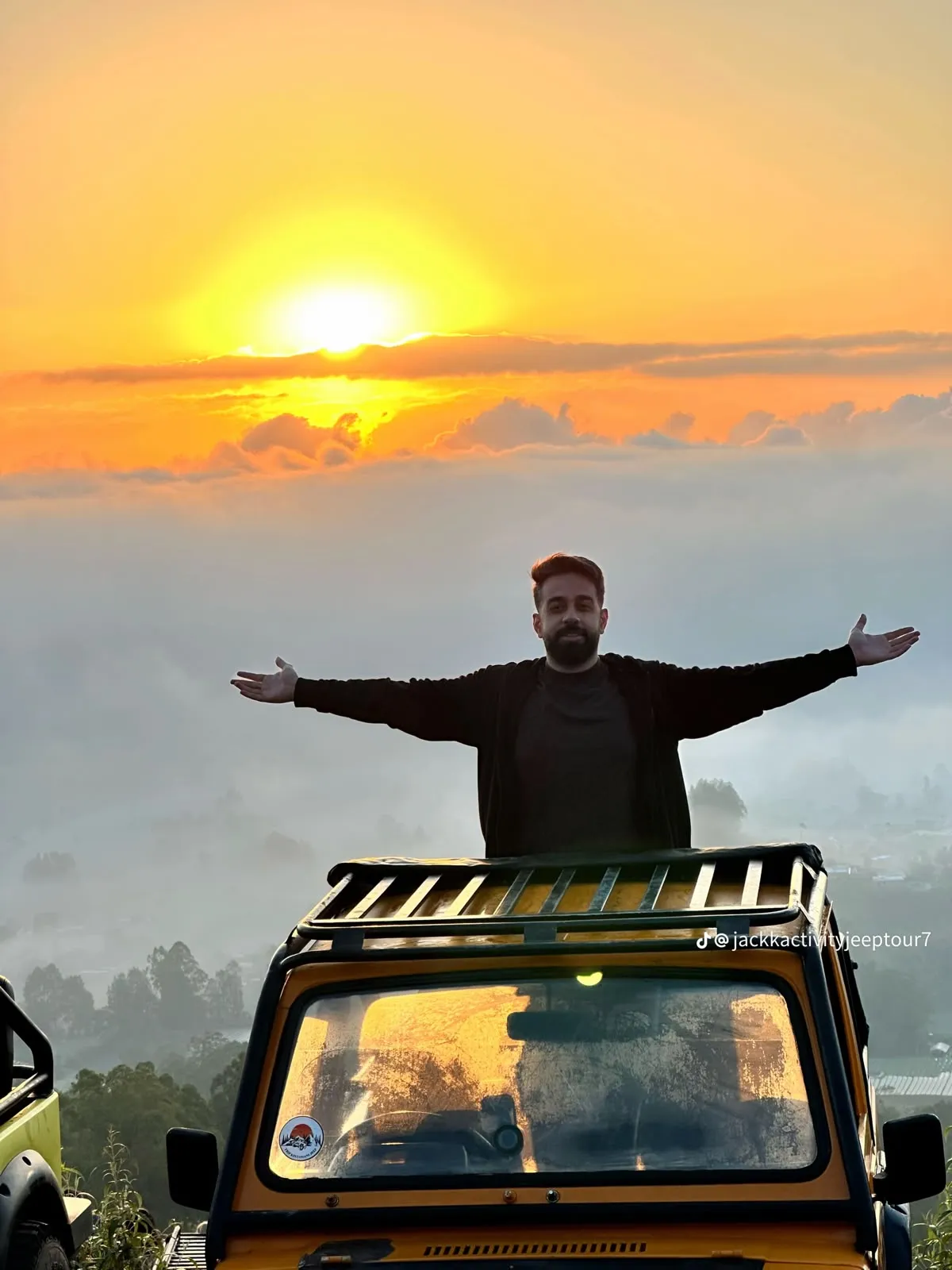 A 4x4 jeep on a dirt track in open country, the kind of vehicle used for a sunrise ride.