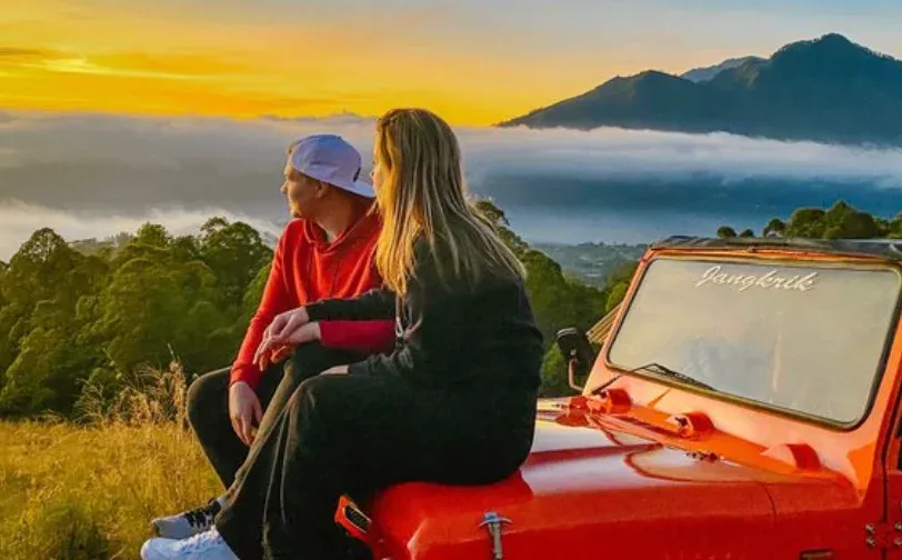 Mount Agung and Mount Abang at sunrise, seen across Lake Batur from Mount Batur. Not a photograph of a Ferry Mount Batur jeep.