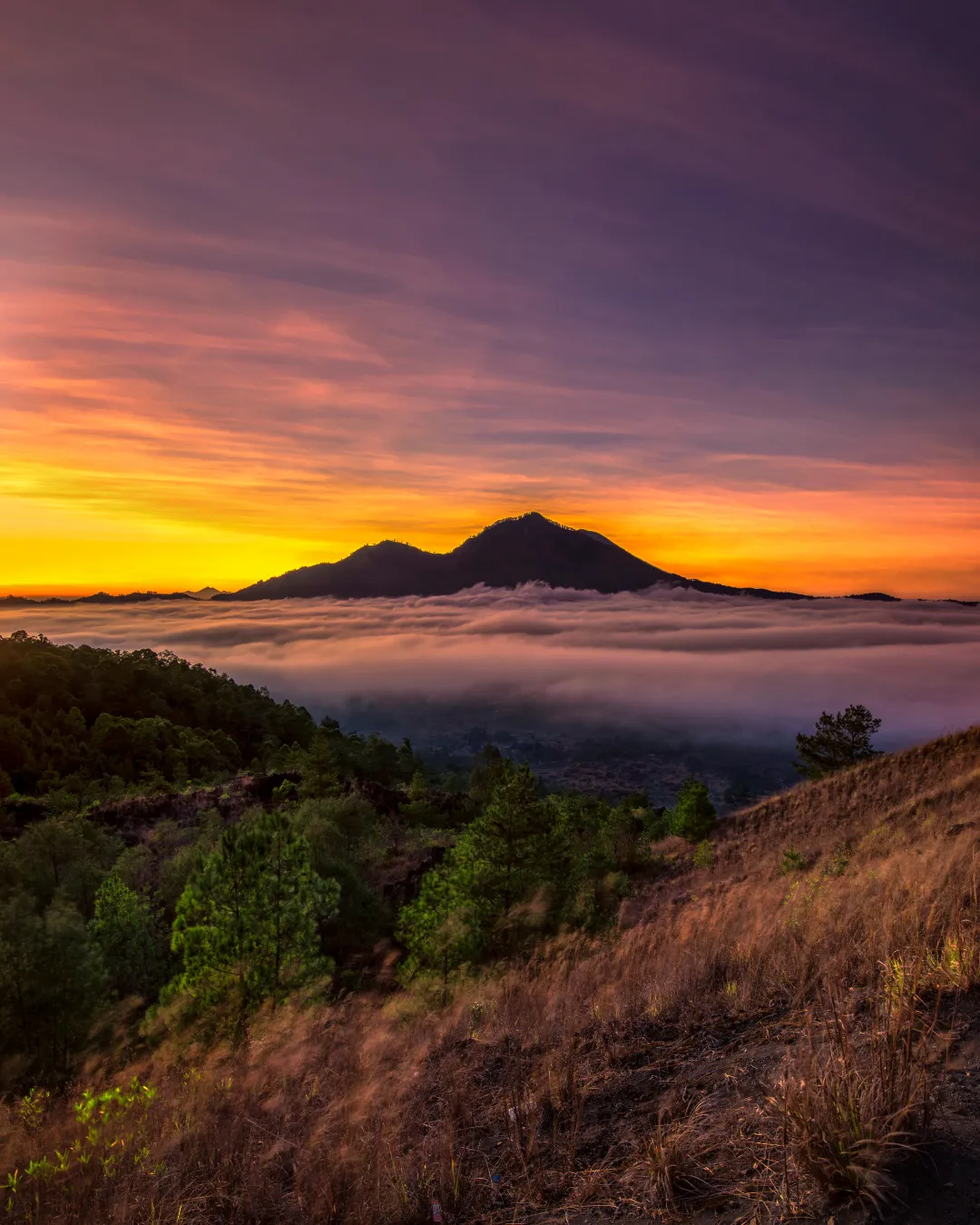 Sunrise over a mountain ridge in Bali