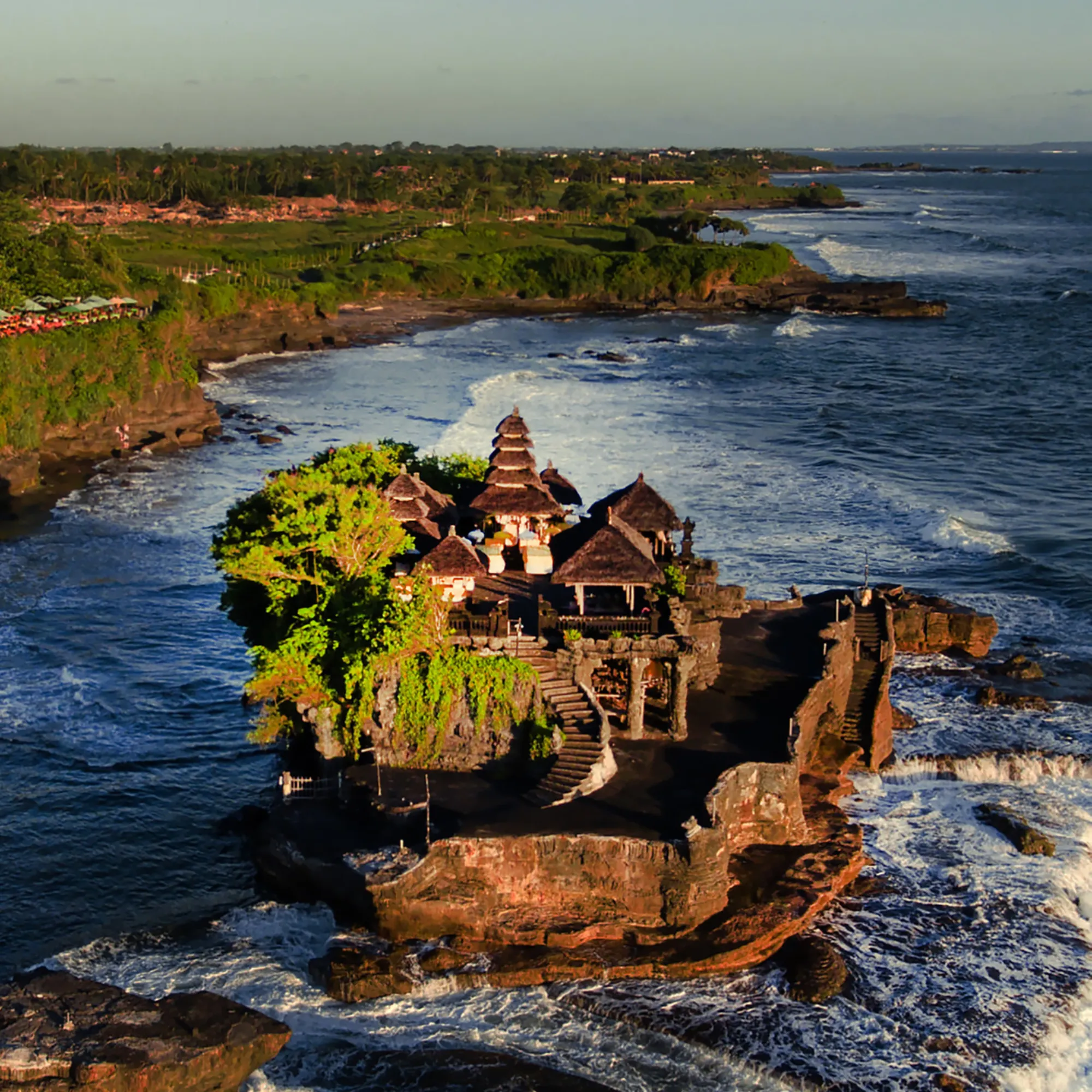 Tanah Lot temple on the sea at sunset