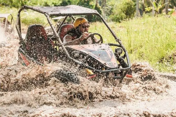 UTV buggy splashing through mud in Bali