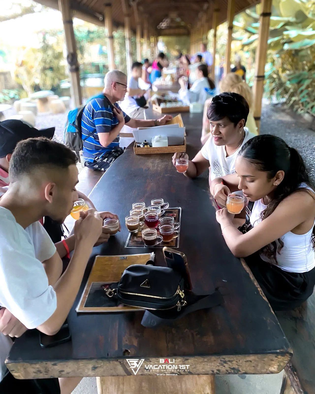 Guests tasting coffee at a Bali pavilion