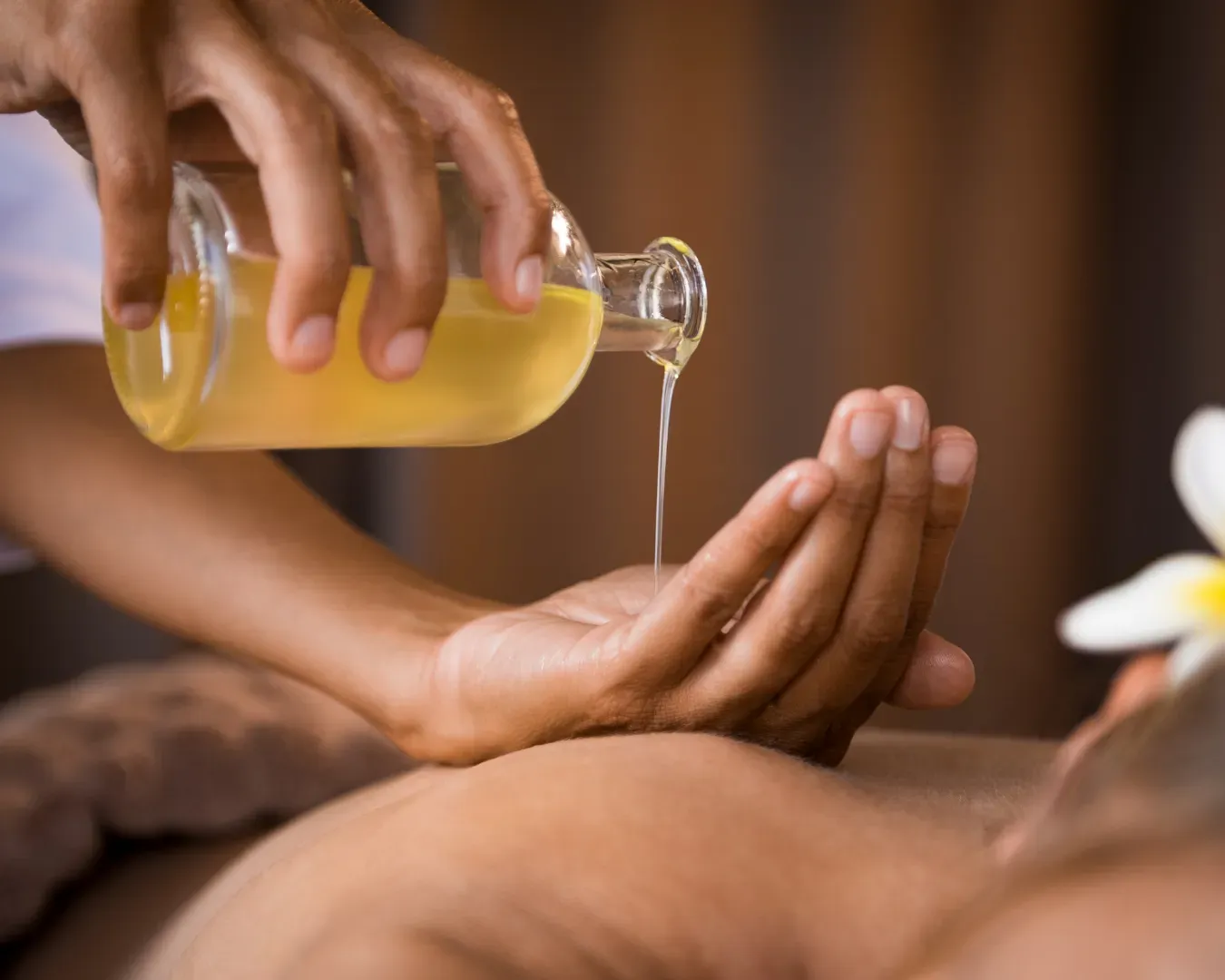 Spa body treatment with oil and herbs