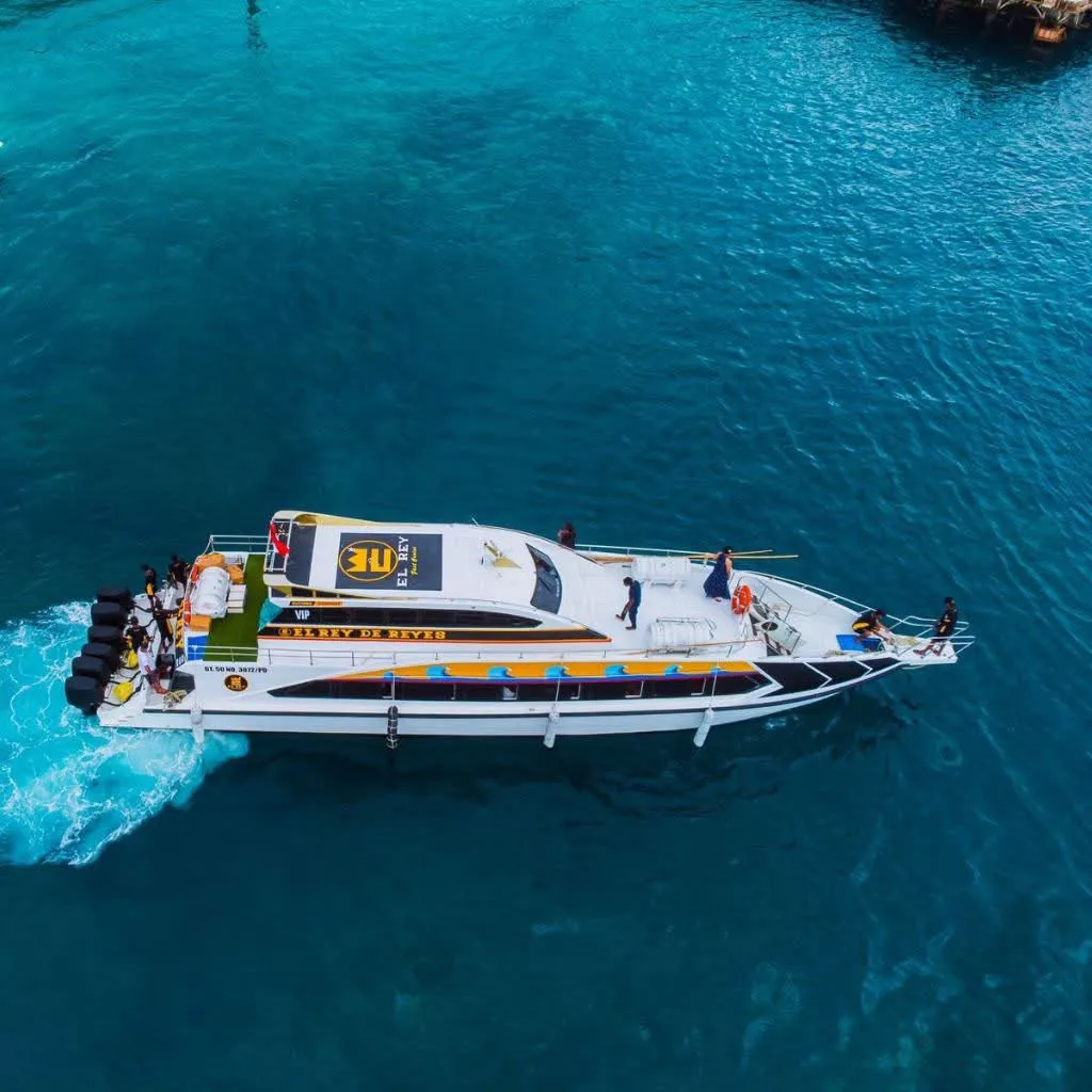 A fast boat crossing turquoise water near Bali