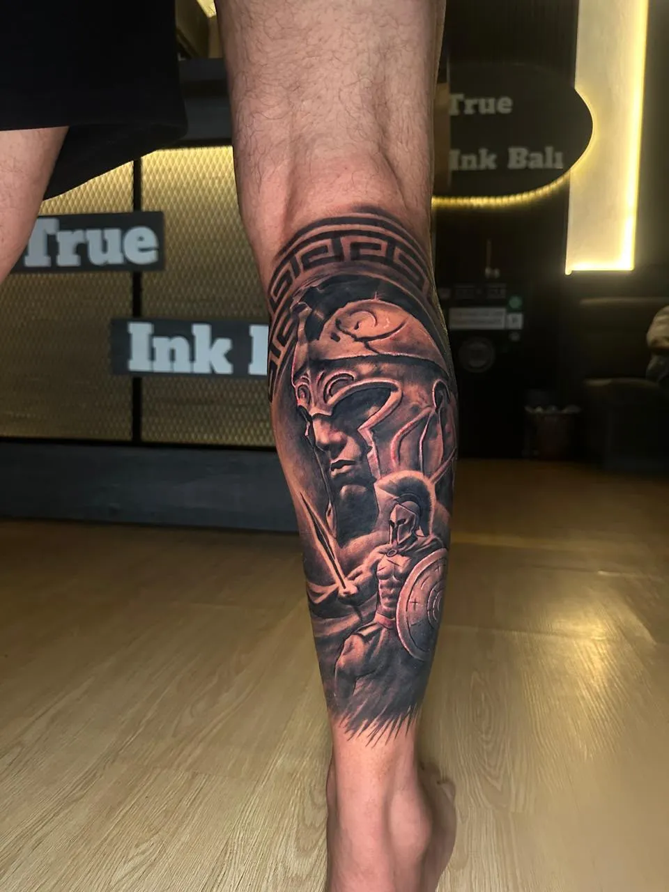 Full-back realistic tattoo in front of The True Ink Bali wall