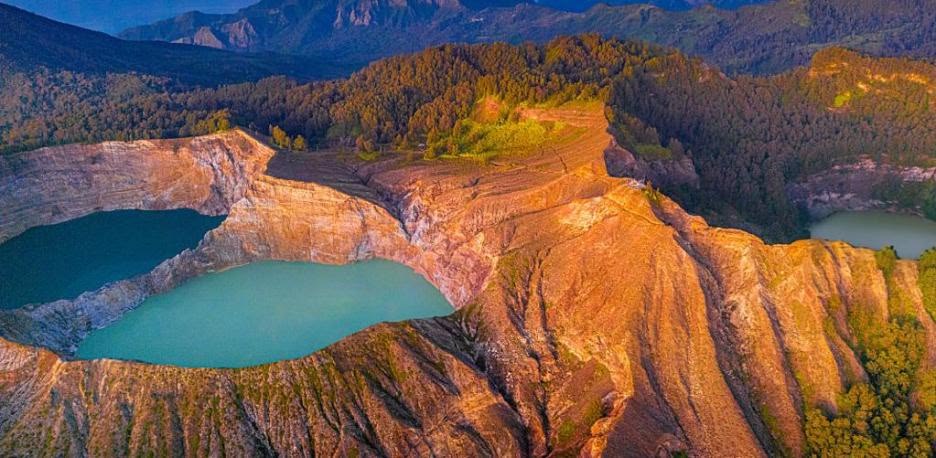 Turquoise crater lake in a volcanic highland landscape