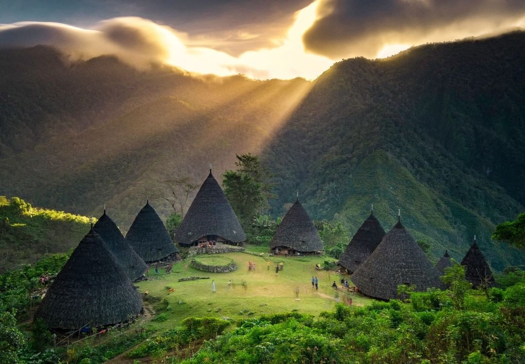 Mountain village surrounded by green highlands