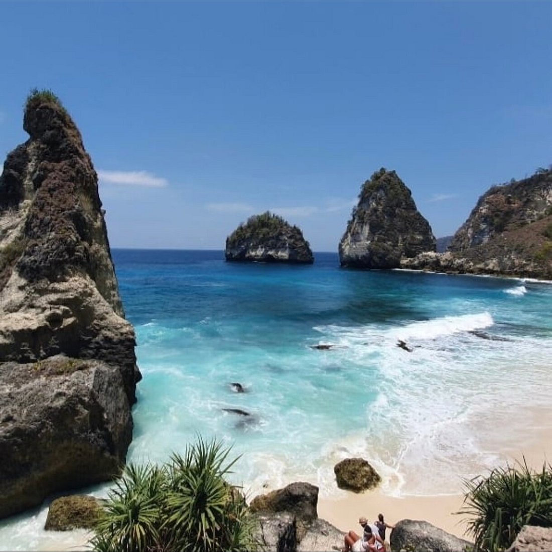 Atuh Beach surrounded by dramatic cliffs