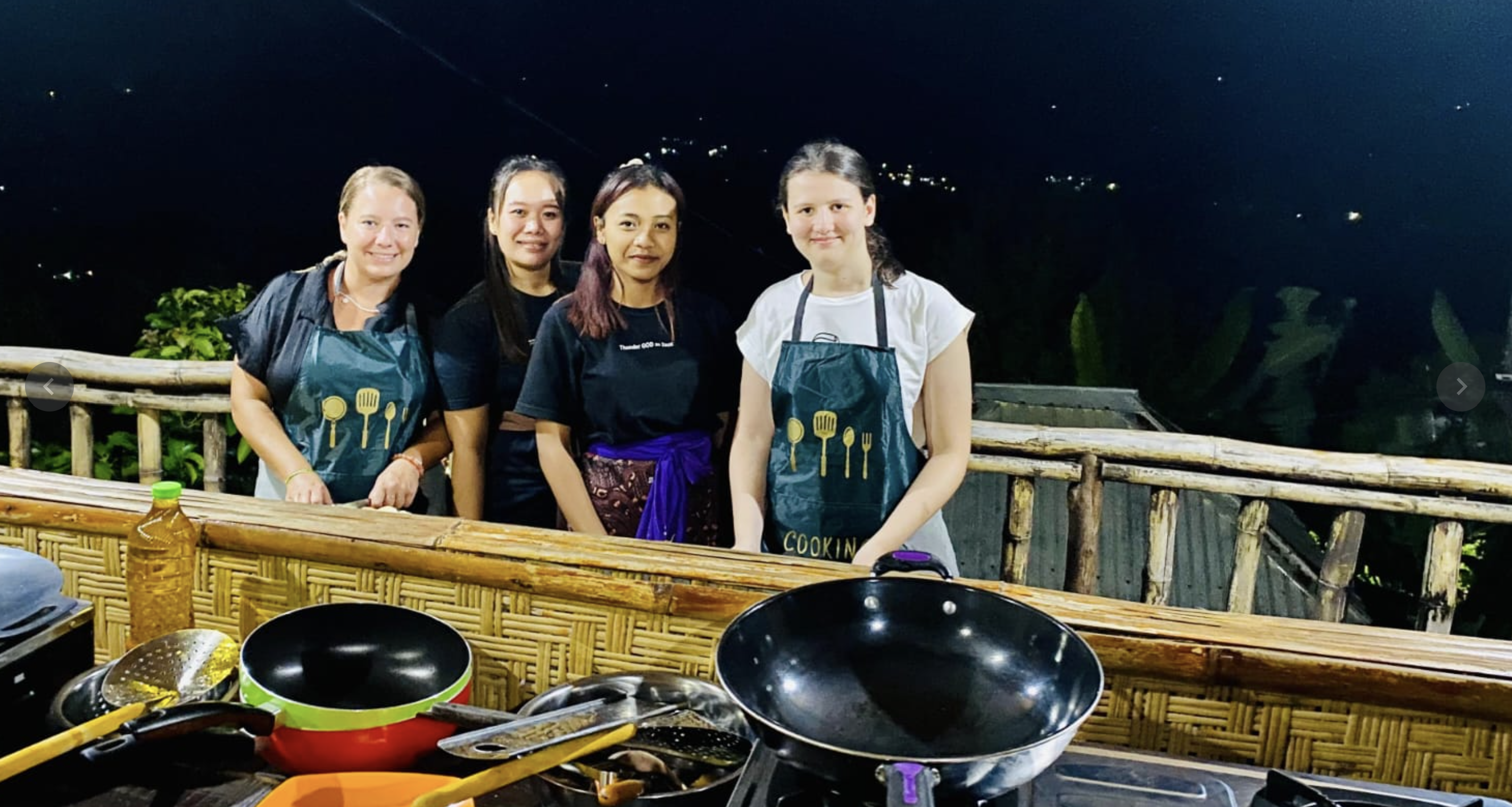 Satay skewers cooking over glowing charcoal