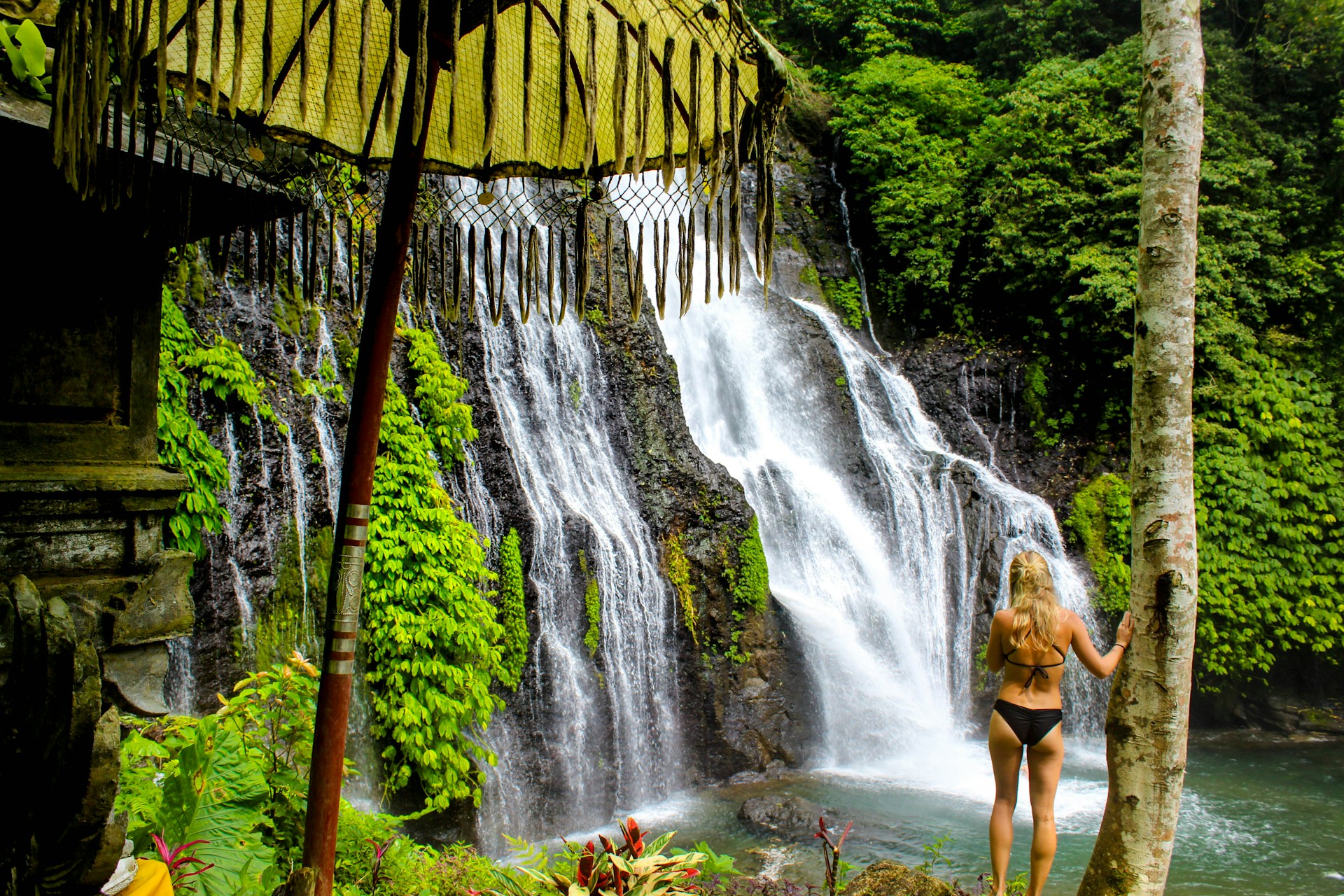 Waterfall cascading through lush jungle in North Bali