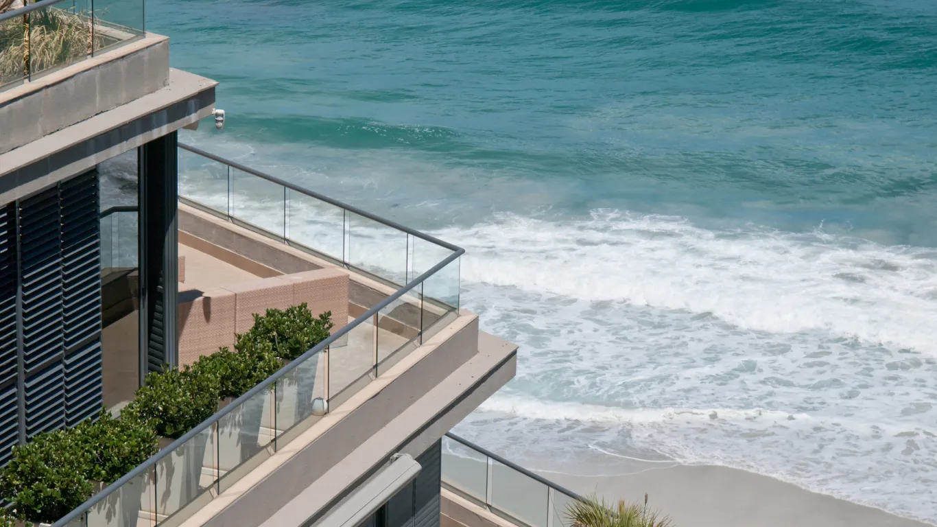 Conceptual image of a contemporary villa on a coastal ridge — not a building on a Mareje plot