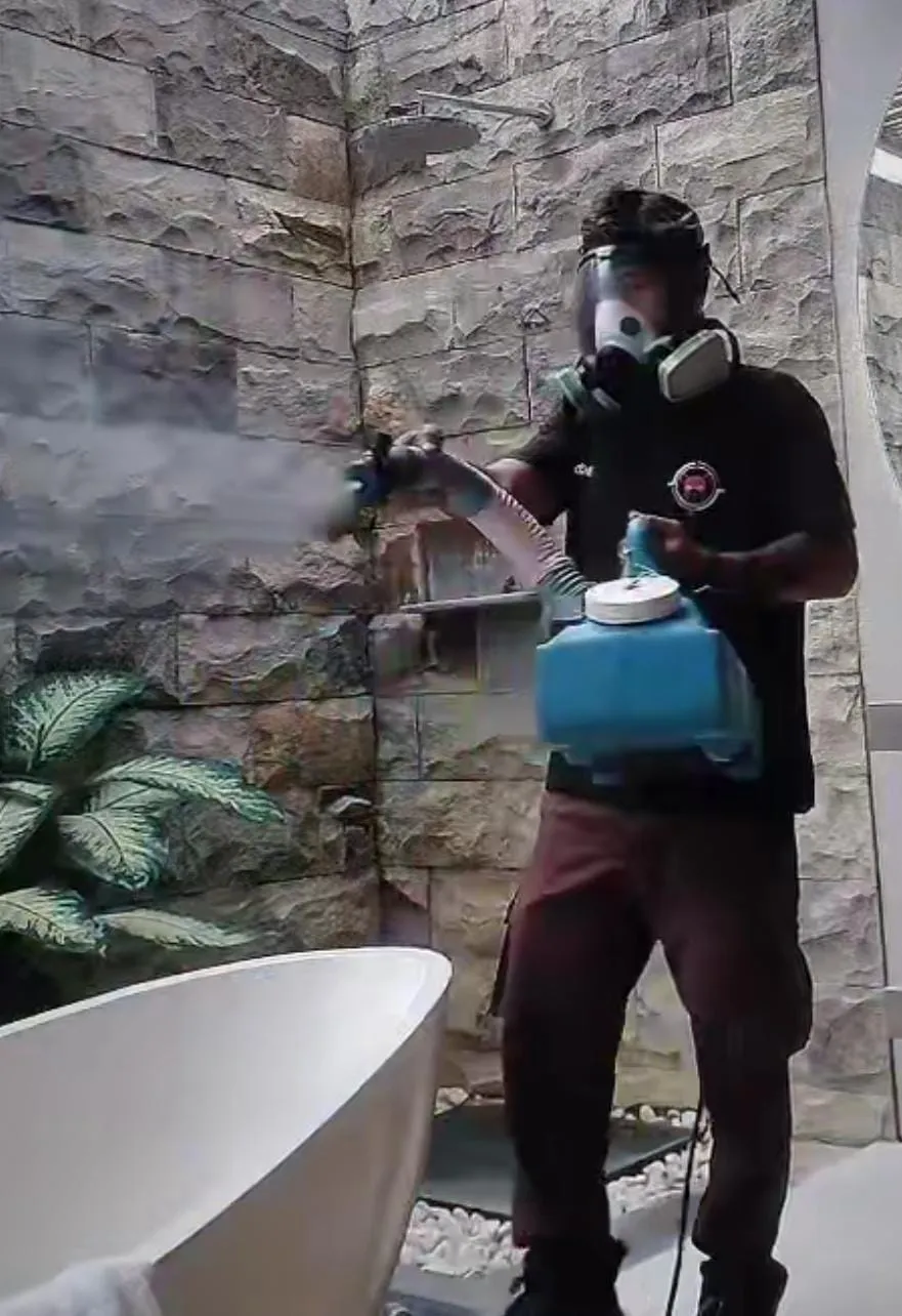 Technician treating an outdoor area