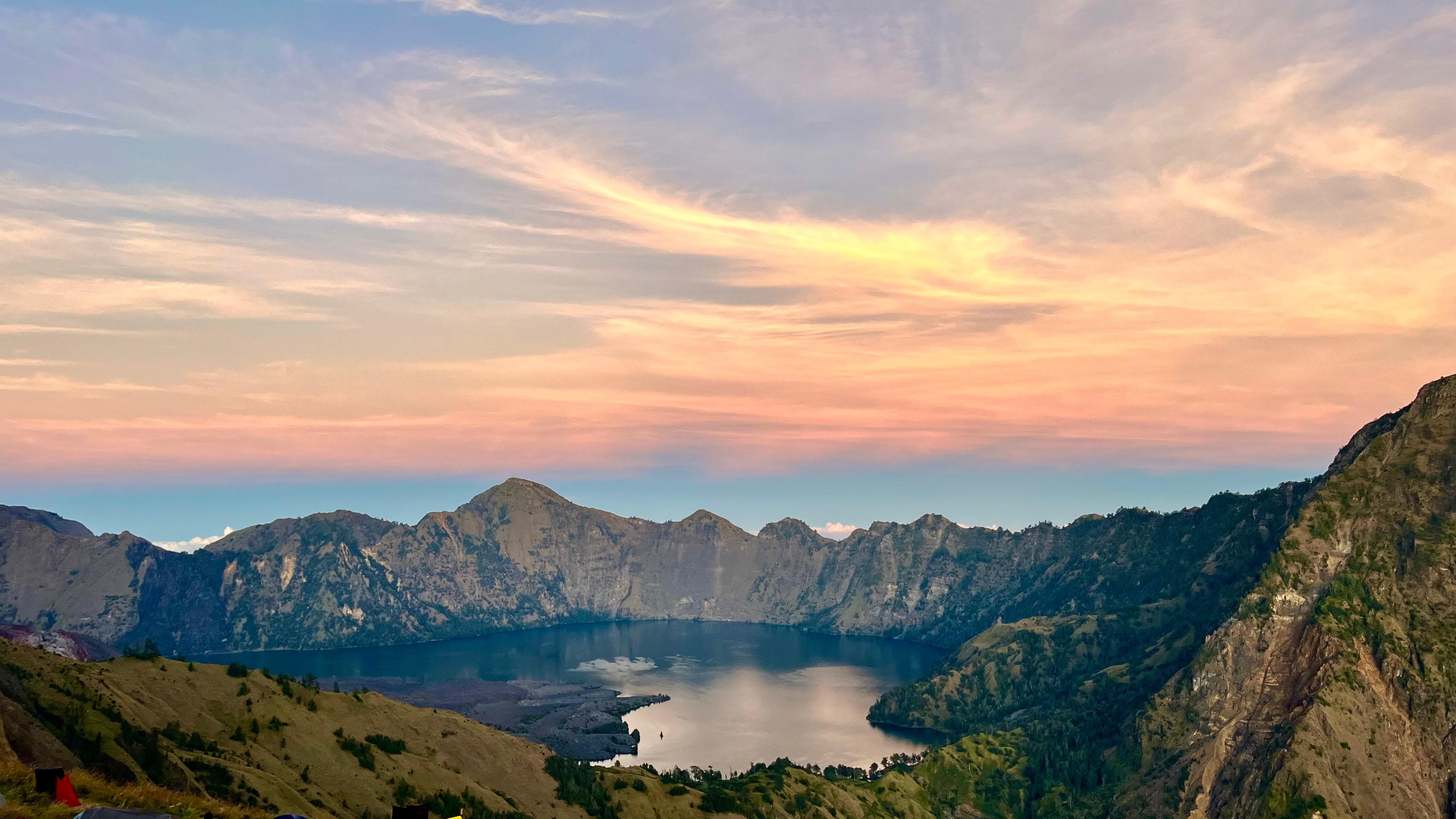 Mount Rinjani ridge at sunrise with sea of clouds in the distance