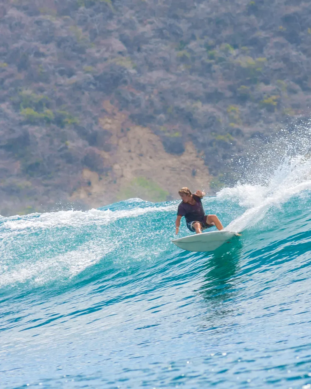 Aerial view of a surfer on open water