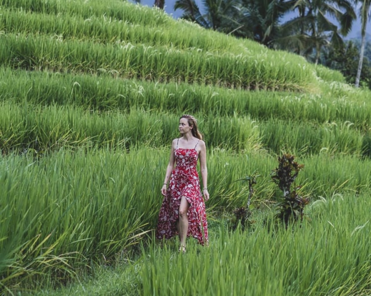 Traveler enjoying the view over Bali rice fields