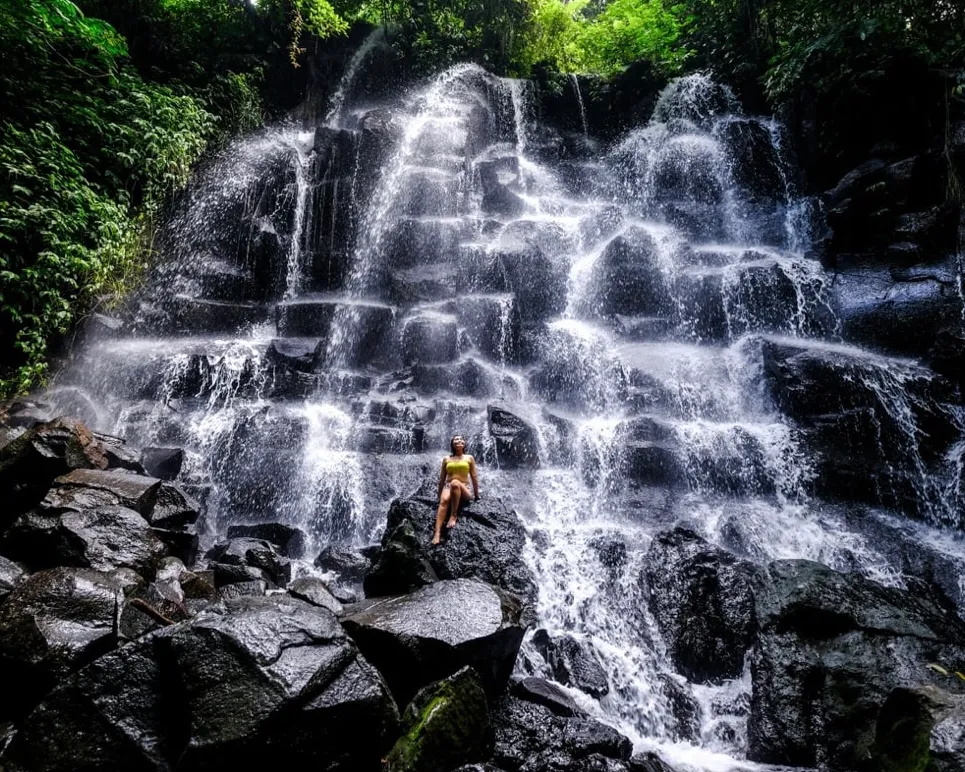 Cliffside jungle waterfall cascading over rock in Bali