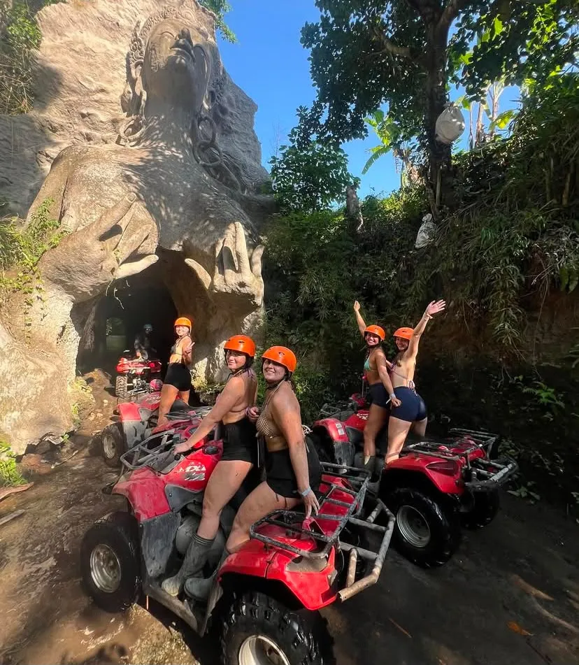 Group on ATVs at the carved cave stop in Ubud