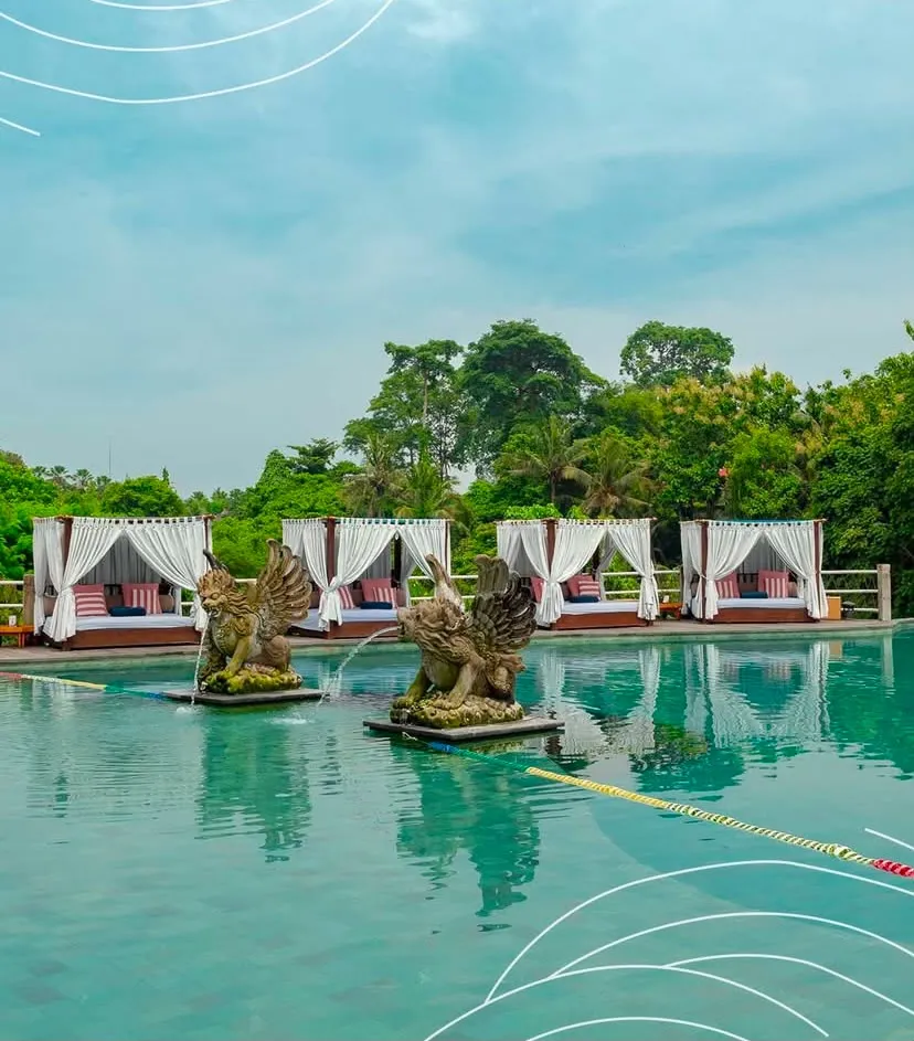 Pool with griffin fountains and cabanas at Tlaga Singha