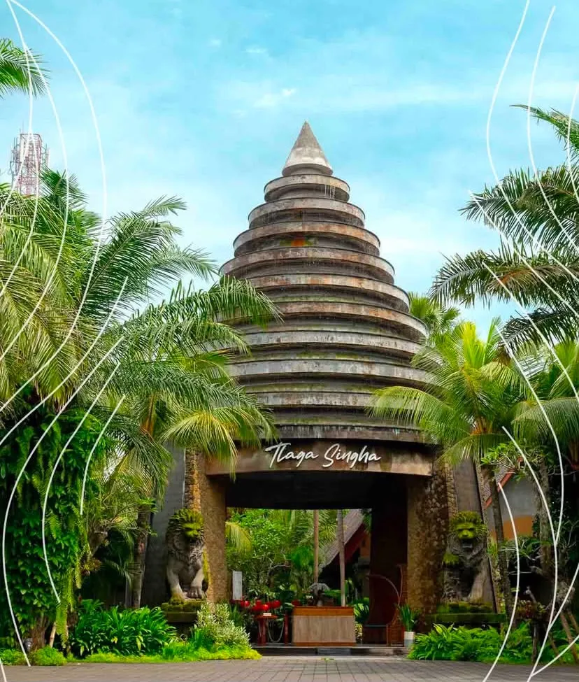 Tlaga Singha tower gate framed by palm trees