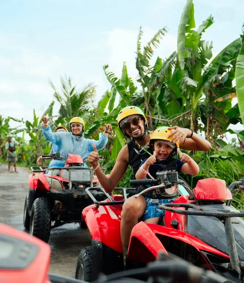 Family on ATVs through banana groves near Ubud