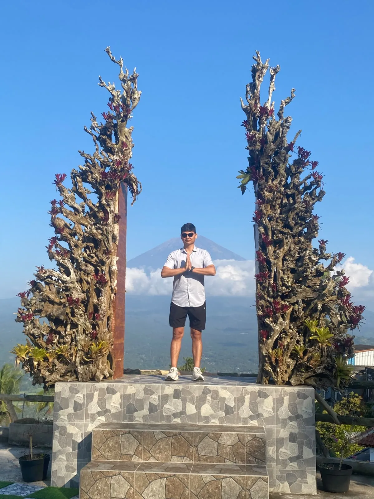Guest at a photo gate with Mount Agung behind