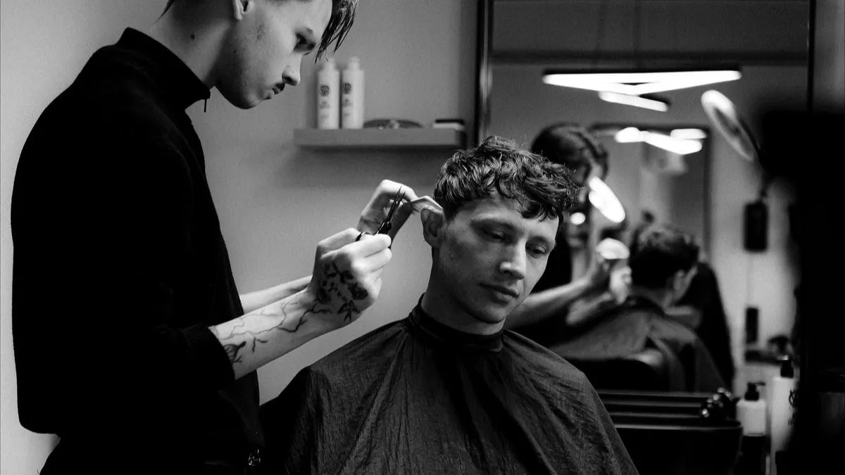 Barber working on a cut
