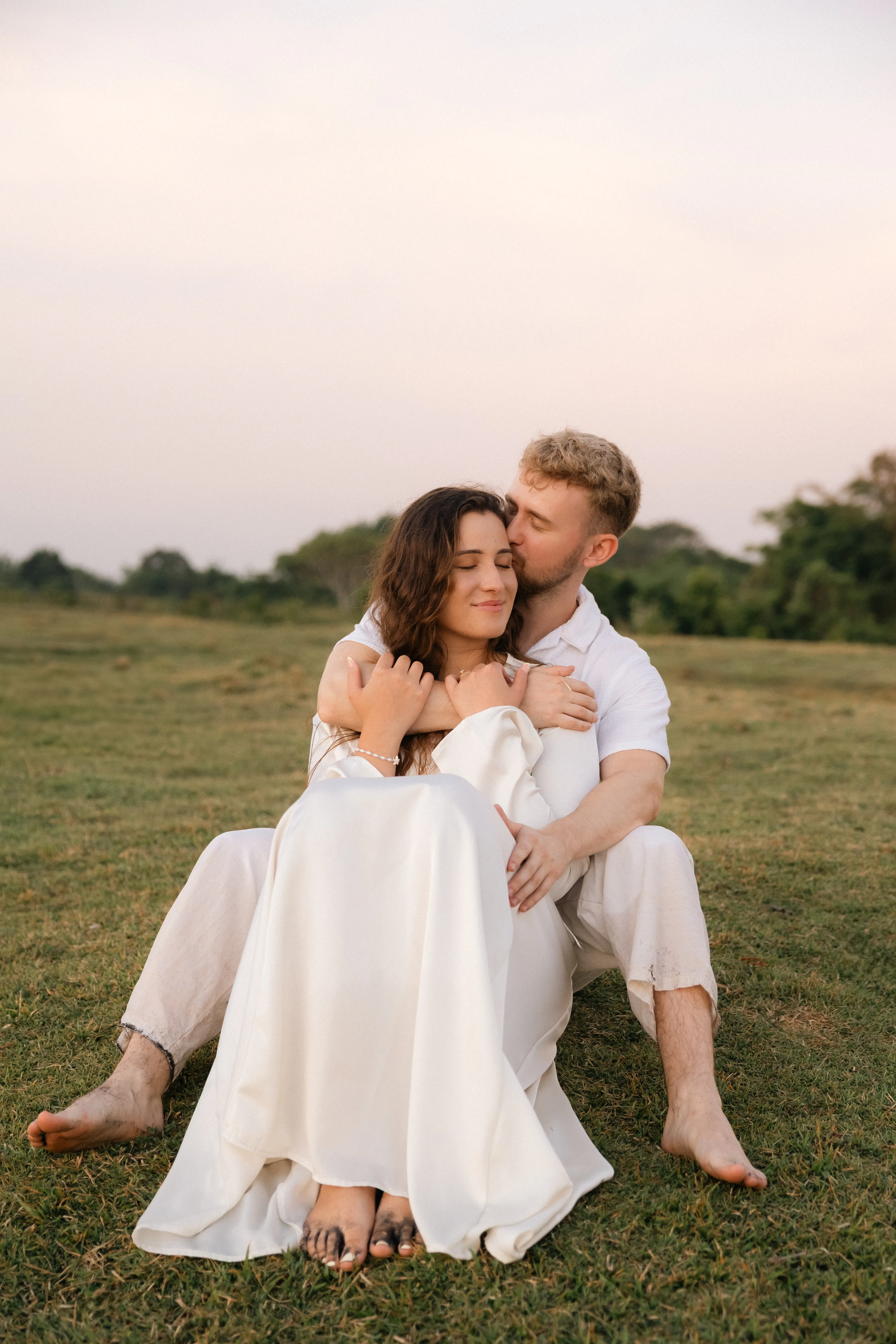 Candid couple laugh during a photoshoot