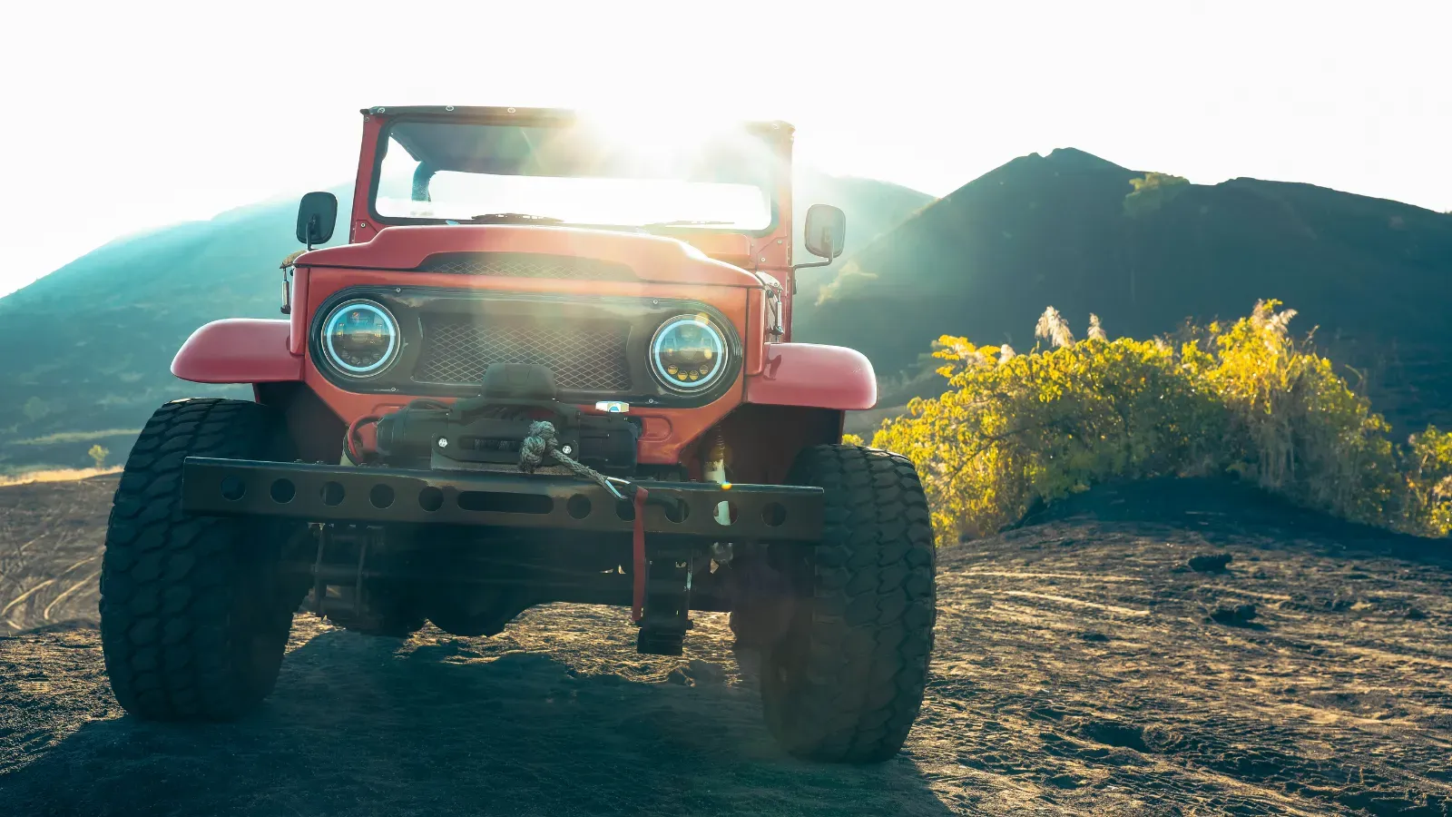 Open road across dark volcanic terrain