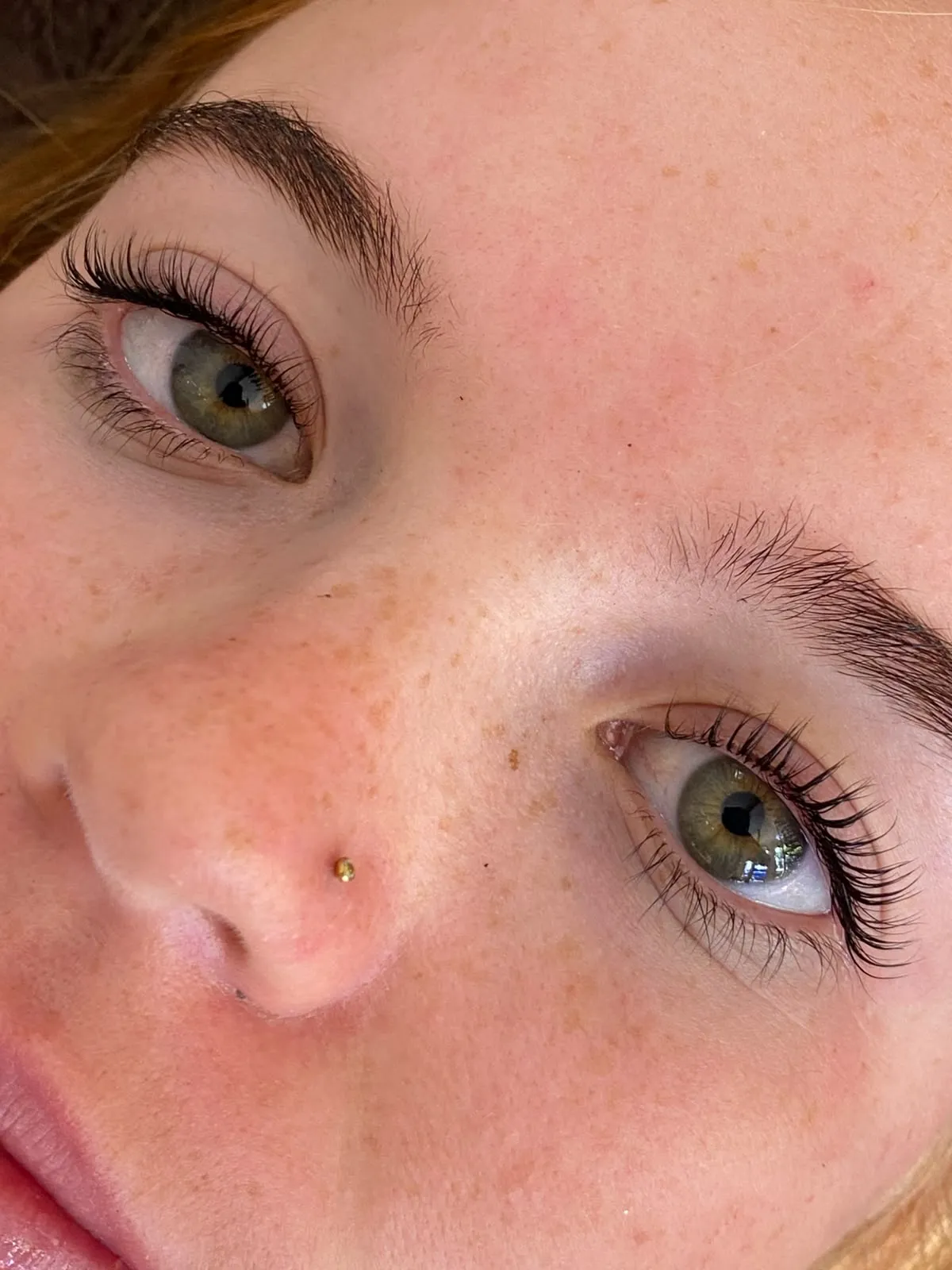 Close-up of lashes and mascara wand