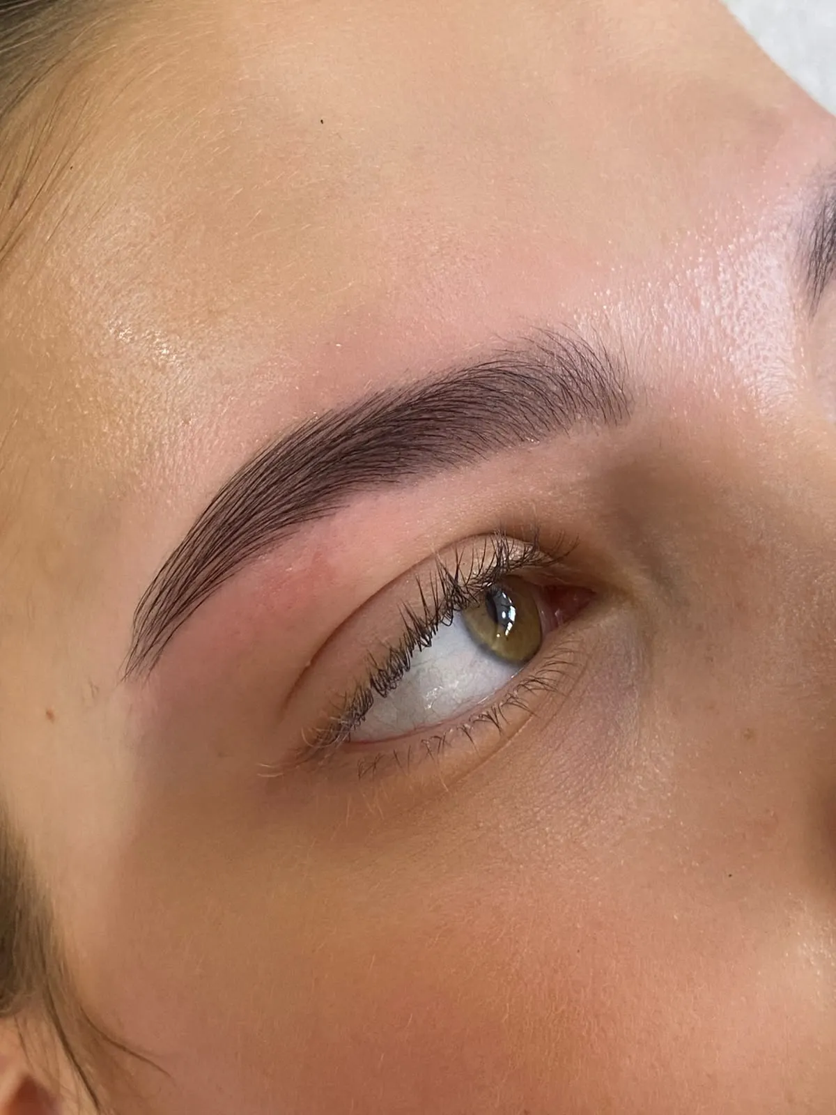 Brow makeup being applied with a brush
