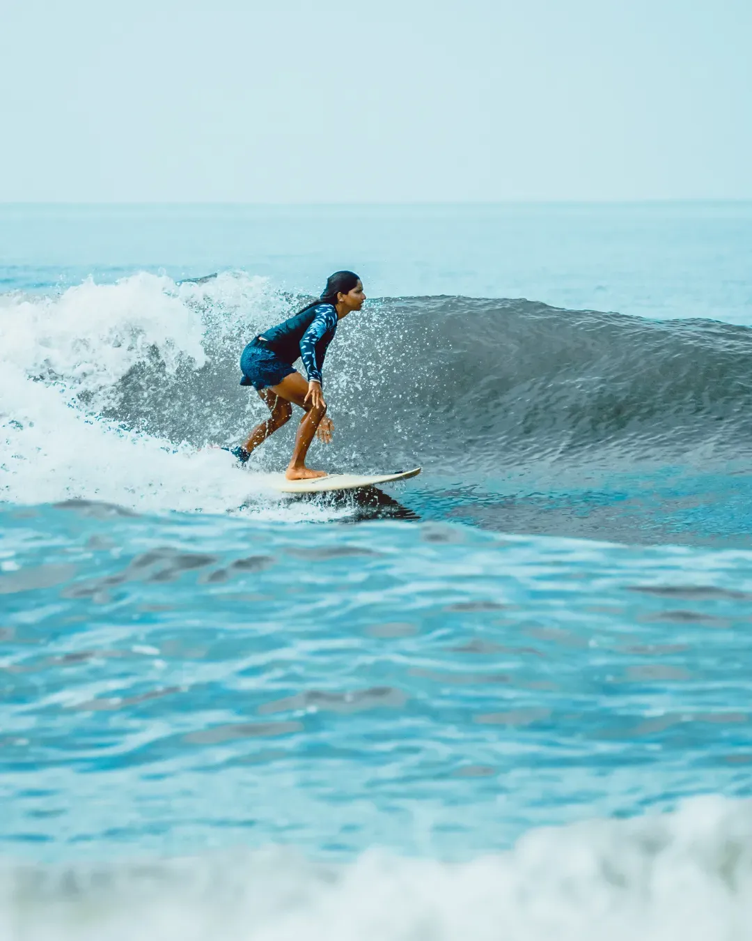 Turquoise shoreline and open ocean along a Bali beach