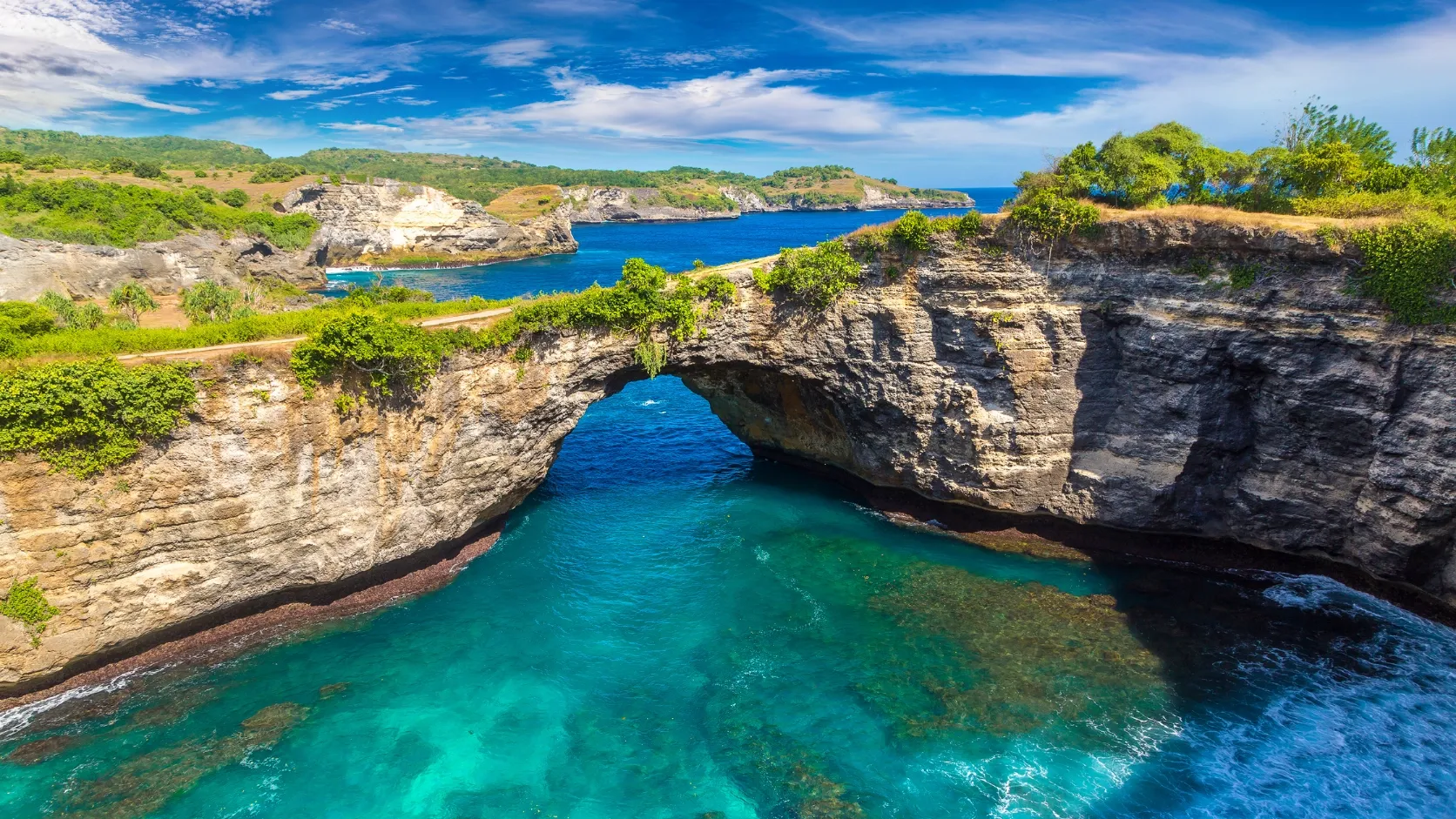 Sandy cove and hills on the east coast of Nusa Penida