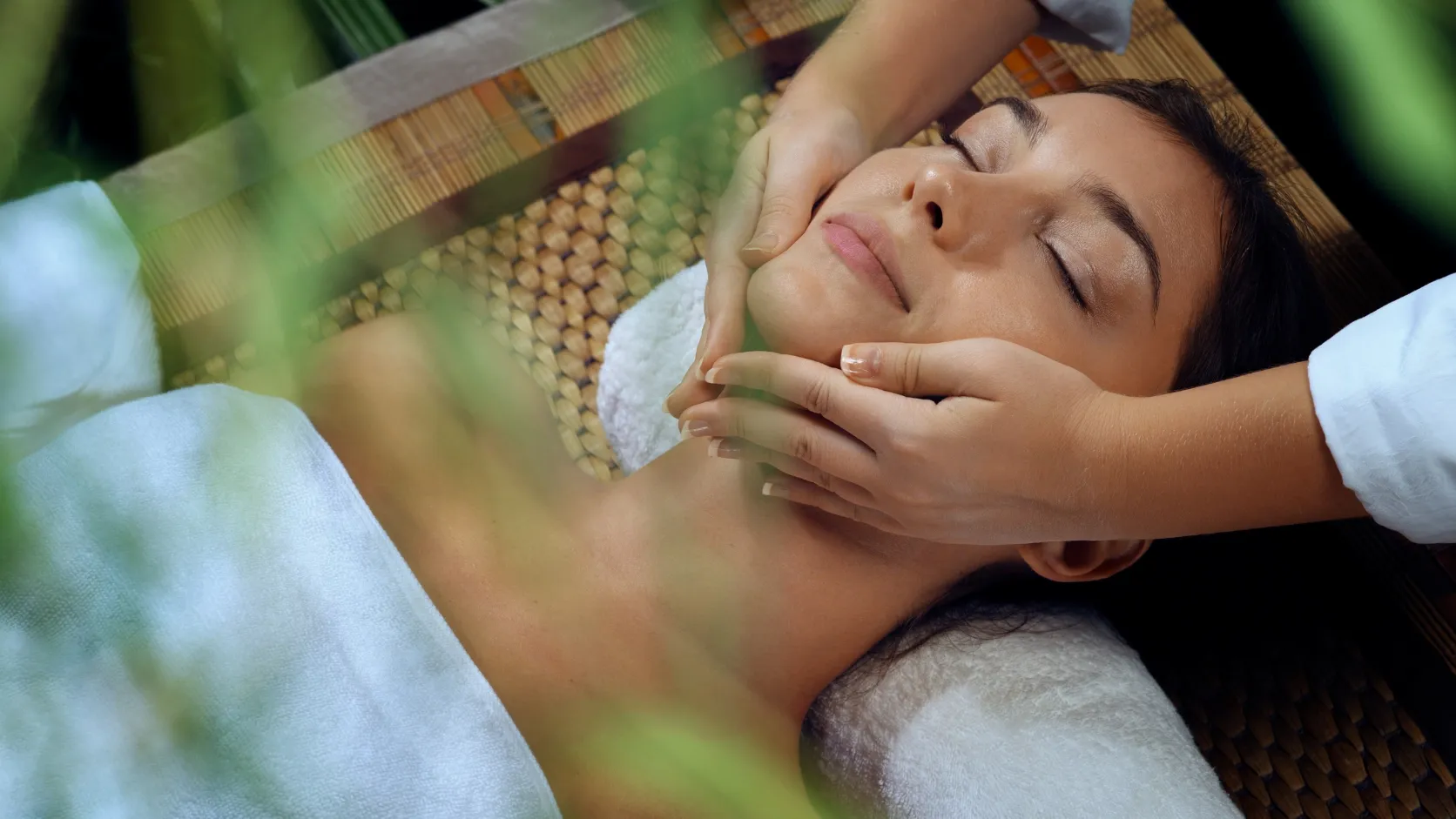 Spa oils and folded towels