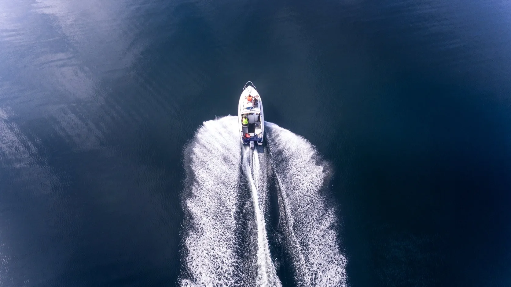 Small boat on clear tropical water