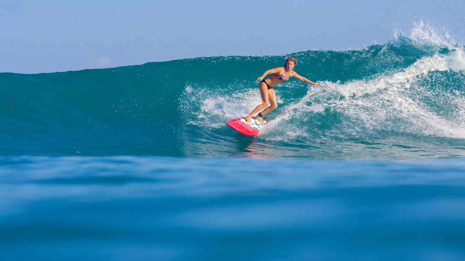 Open tropical ocean and shoreline before a surf lesson