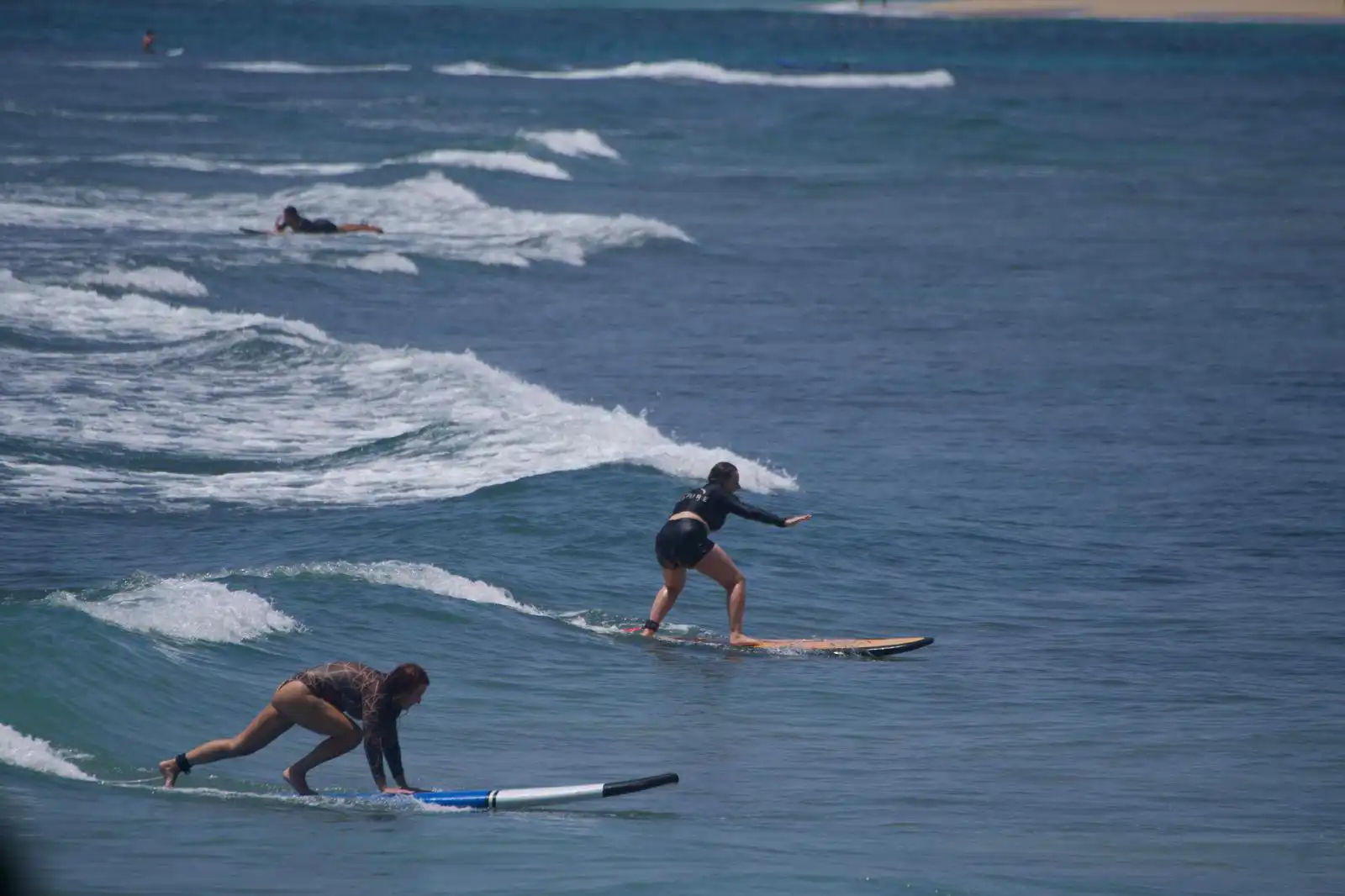 Surfer dropping into a clean wave at Balangan Beach