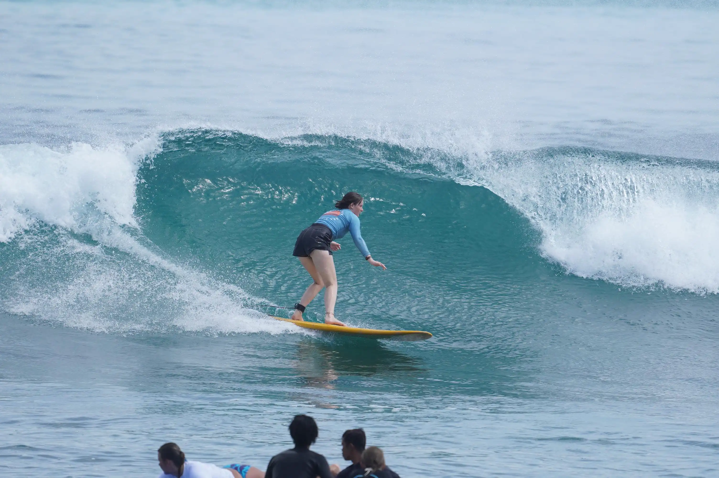 Open tropical ocean and shoreline before a surf lesson